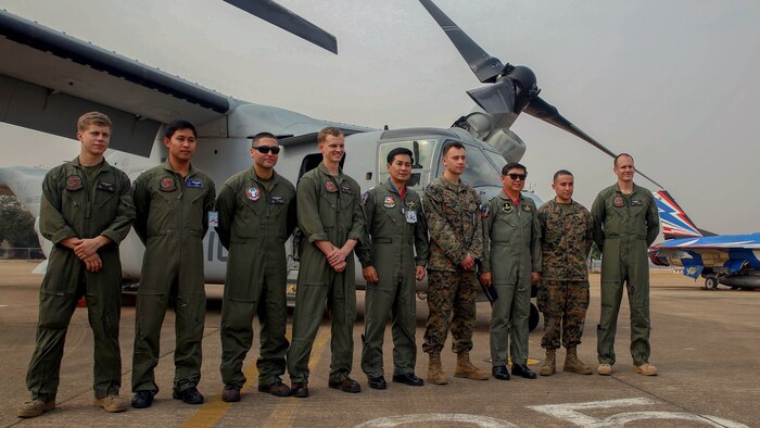 Air Vice-Marshal Bhanupong Seyayongka, third from the right, stands with Royal Thai Air Force personnel and U.S. Marines from Marine Medium Tiltrotor Squadron 262, Marine Aircraft Group 36, I Marine Aircraft Wing, III Marine Expeditionary Force for a picture in front of a U.S. Marine MV-22 Osprey and a RTAF F-16 Air Defense Fighter at an open house held by Royal Thai Air Force Wing 1 and U.S. Marines at Royal Thai Air Force Base Korat during Exercise Cobra Gold 2015, Feb. 13. Cobra Gold is a Thailand /United States co-sponsored, multinational and joint theater security cooperation exercise, conducted annually in the Kingdom of Thailand, with 25 nations participating. This year there is an increased focus on Humanitarian Civic Action, community engagement, and medical activities to support the needs and humanitarian interests of civilian populations around the region.