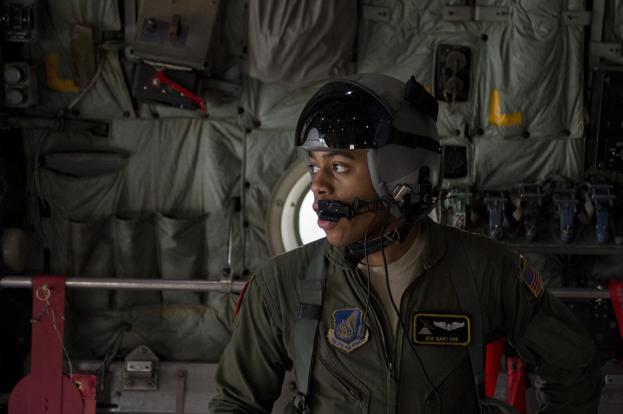 Senior Airman Gary Coe monitors the off-load of cargo used during a humanitarian assistance and disaster relief training event Feb. 15, 2015, during exercise Cope North 15 at Rota, Northern Mariana Islands. The exercise enhances humanitarian assistance and disaster relief crisis response capabilities between six nations and lays the foundation for regional cooperation expansion during real-world contingencies in the Asia-Pacific Region. Coe is a 36th Airlift Squadron C-130 Hercules loadmaster. (U.S. Air Force photo/Tech. Sgt. Jason Robertson)