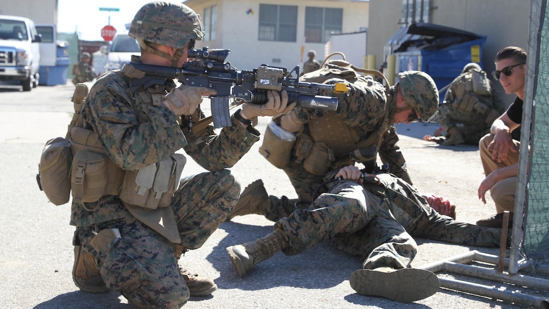 Marines and Sailors with Company K, 3rd Battalion, 7th Marine Regiment, triage and evacuate role-playing victims of a simulated vehicle-borne improvised explosive device during an embassy reinforcement scenario on Joint Forces Training Base Los Alamitos, Feb. 12, 2015. This training was a part of the Special Purpose Marine Air Ground Task Force Crisis Response – Central Command – 15.2 certification exercise, conducted across several locations in the Western United States. The purpose of the CERTEX was to test and certify SPMAGTF CR-CC 15.2 across a broad spectrum of mission essential tasks.