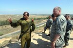 An Israeli officer briefs Air Force Gen. Craig McKinley, the chief of the National Guard Bureau, from an observation post overlooking the Gaza strip near the Israeli city of Sderot on May 25, 2010. A National Guard delegation is visiting the country to strengthen a relationship with the Israeli Defense Force's Home Front Command and to observe National Level Exercise Turning Point 4.