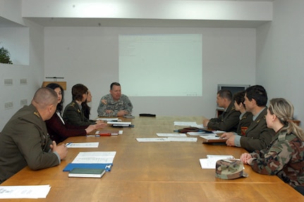 Army Maj. Matt Handley, state public affairs officer for the North Carolina National Guard, meets with Moldovan Ministry of Defense Public Affairs personnel on May 3, 2010 in Chisnau Moldova as part of the State Partnership Program. The five-day workshop was to exchange best practices regarding public affairs and public information.