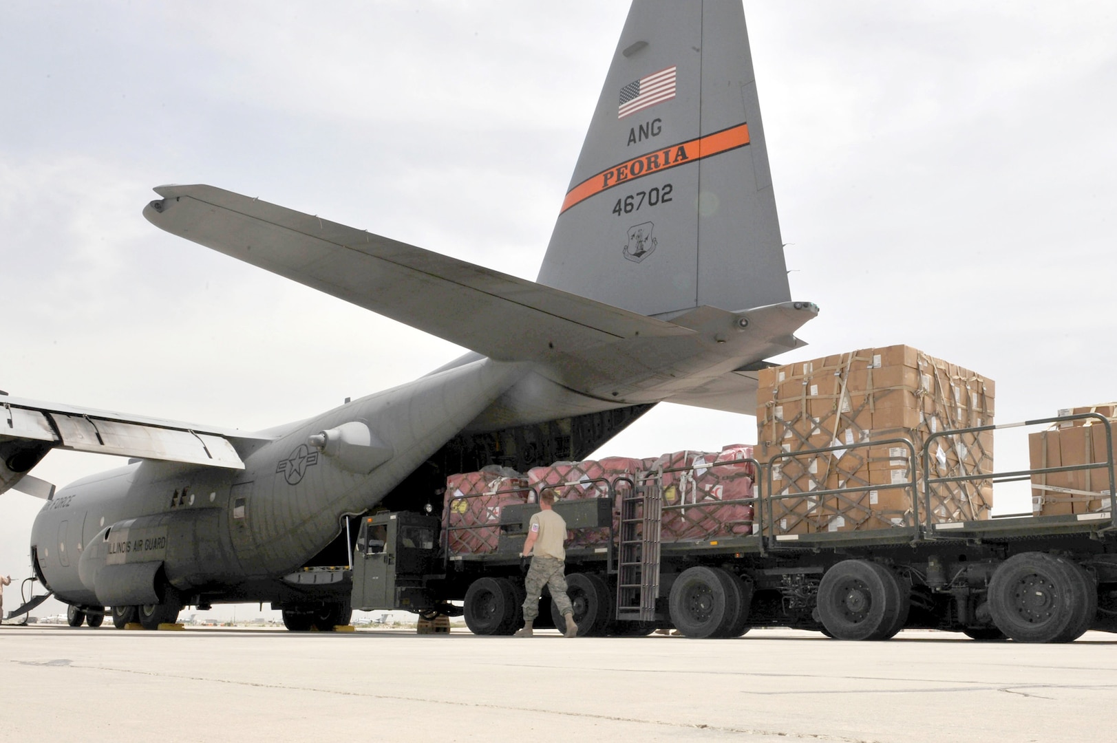A C-130 Hercules from the Illinois Air National Guard is loaded with medical supplies, hygiene kits and water in support of flood relief efforts for the people of Tajikistan at Bagram Airfield, Afghanistan May 21, 2010.