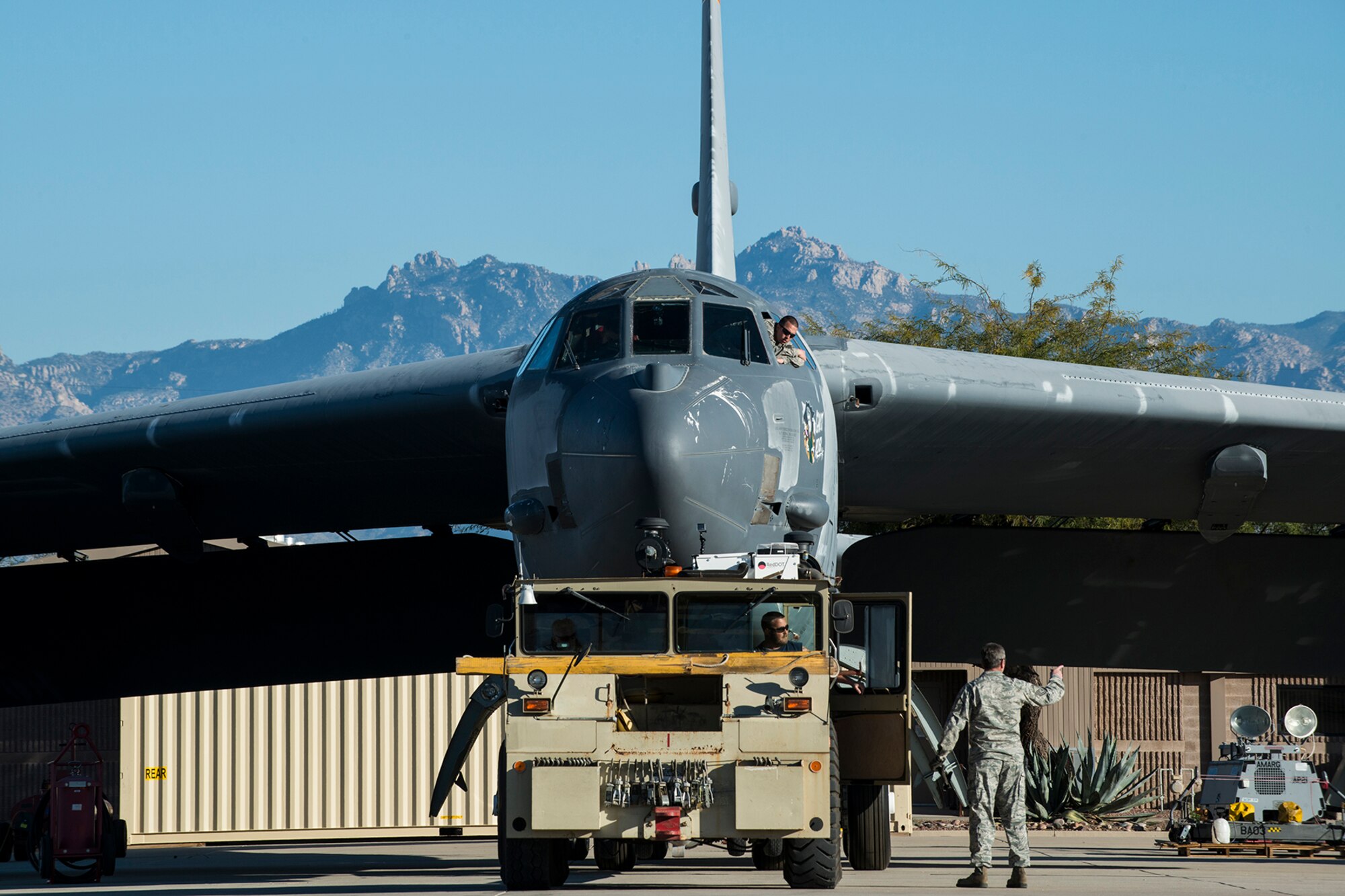 A U.S. Air Force B-52 Stratofortress is towed from a maintenance area at the 309th Aerospace Maintenance and Regeneration Group, Feb. 11, 2015, Davis-Monthan Air Force Base, Ariz. The aircraft, tail number 61-1007 and known as the "Ghost Rider", is being regenerated for active servie after sitting in storage since 2008 when it was decommssioned and sent the Boneyard. (U.S. Air Force photo by Master Sgt. Greg Steele/Released)