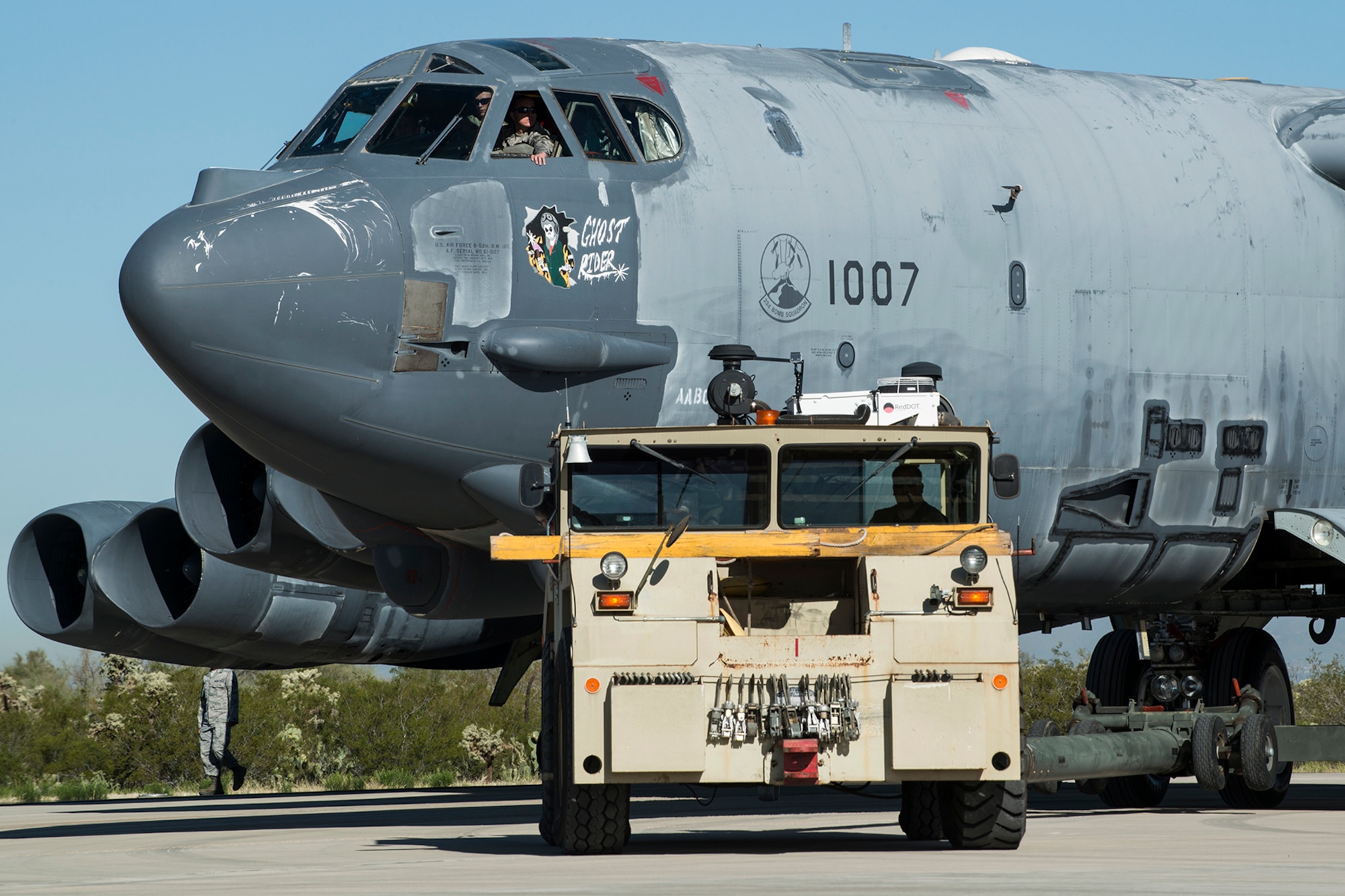 A U.S. Air Force B-52 Stratofortress is towed from a maintenance area at the 309th Aerospace Maintenance and Regeneration Group, Feb. 11, 2015, Davis-Monthan Air Force Base, Ariz. The aircraft, tail number 61-1007 and known as the "Ghost Rider", is being regenerated for active service after sitting in storage since 2008 when it was decommissioned and sent the Boneyard. (U.S. Air Force photo by Master Sgt. Greg Steele/Released)