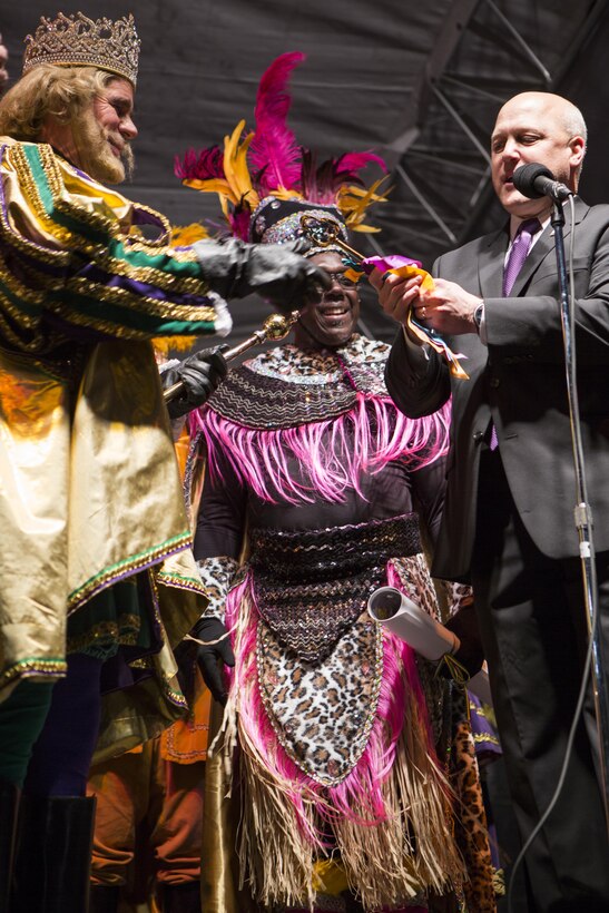 Mitch Landrieu, Mayor of New Orleans, hands the key to the city to Rex, the 
King of Carnival, during the Zulu Lundi Gras Festival in downtown New Orleans, Feb. 16, 2015. Lt. Gen. Richard P. Mills, commander of Marine Forces Reserve, Sgt. Maj. Anthony A. Spadaro, sergeant major of MARFORRES, and Gregg T. Habel, executive director of MARFORRES, attended the event, greeted crowds and continued to show the military’s ongoing support to the New Orleans community.