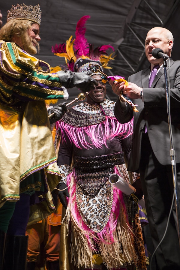 Mitch Landrieu, Mayor of New Orleans, hands the key to the city to Rex, the 
King of Carnival, during the Zulu Lundi Gras Festival in downtown New Orleans, Feb. 16, 2015. Lt. Gen. Richard P. Mills, commander of Marine Forces Reserve, Sgt. Maj. Anthony A. Spadaro, sergeant major of MARFORRES, and Gregg T. Habel, executive director of MARFORRES, attended the event, greeted crowds and continued to show the military’s ongoing support to the New Orleans community.