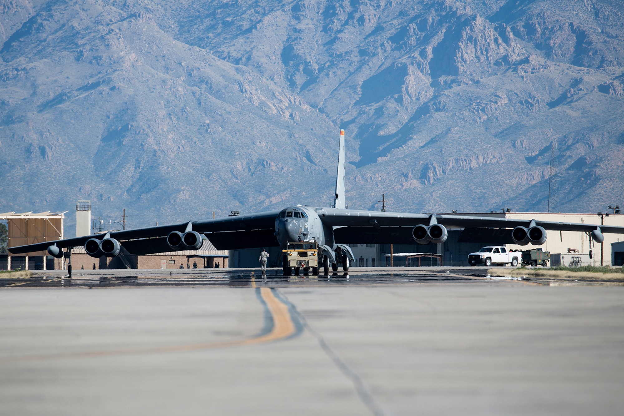 A U.S. Air Force B-52 Stratofortress is towed from a maintenance area at the 309th Aerospace Maintenance and Regeneration Group, Feb. 11, 2015, Davis-Monthan Air Force Base, Ariz. The aircraft, tail number 61-1007 and known as the "Ghost Rider", is being regenerated for active service after sitting in storage since 2008 when it was decommissioned and sent the Boneyard. (U.S. Air Force photo by Master Sgt. Greg Steele/Released)