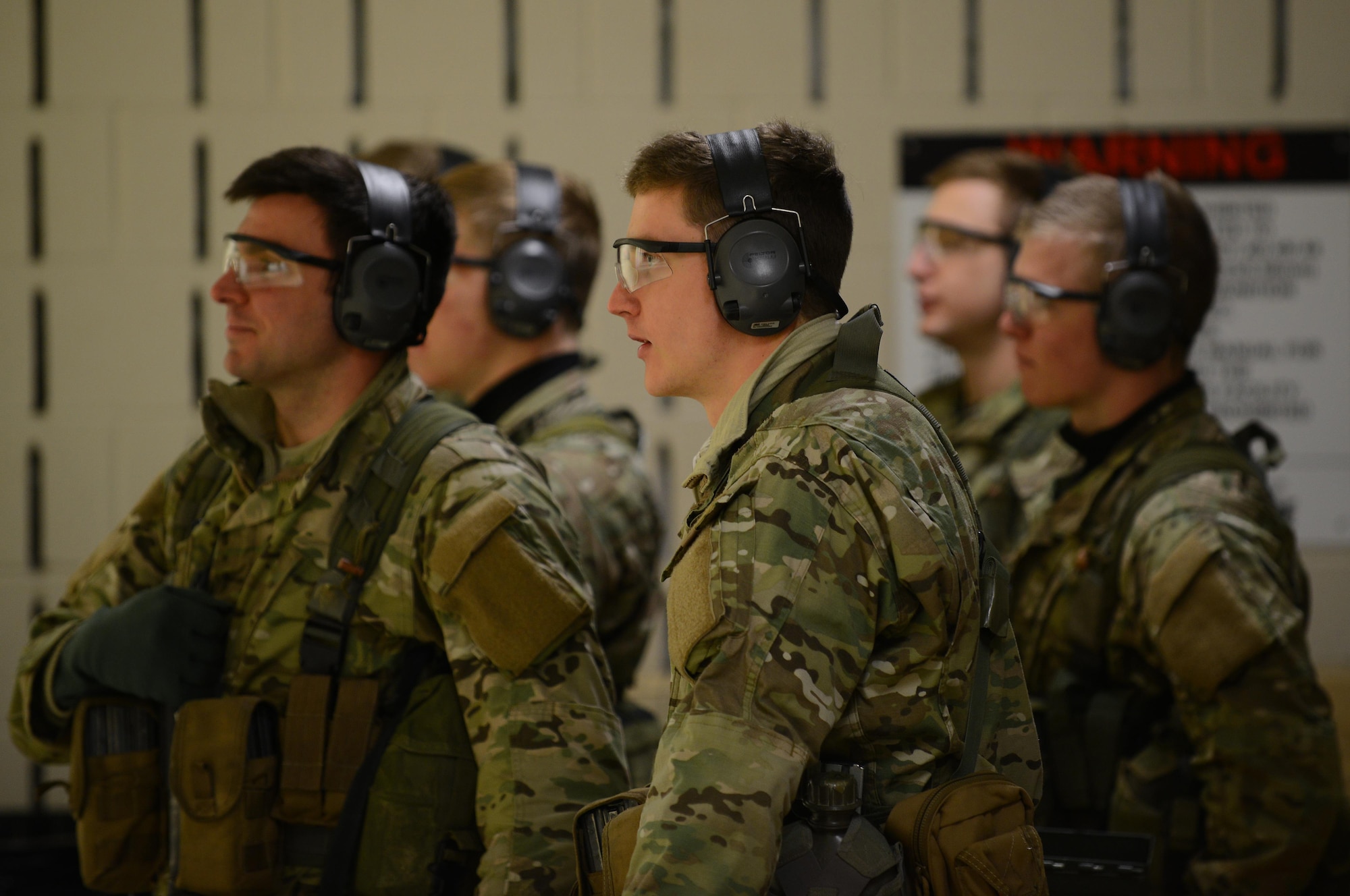 U.S. Air Force Combat Control trainees assigned to Operating Location C, 342nd Training Squadron, await their turn to shoot at Pope Army Airfield, North Carolina, Feb. 11, 2015. Before being assigned to a unit, CCT and Special Operations Weather Team trainees have to complete a rigorous training pipeline which can take approximately two years. (U.S. Air Force photo by Airman 1st Class Michael Cossaboom)