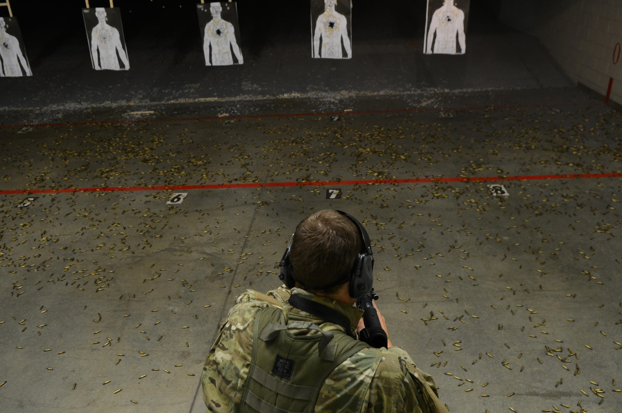 U.S. Air Force Combat Control trainees assigned to Operating Location C, 342nd Training Squadron, fire an M4 rifle at Pope Army Airfield, North Carolina, Feb. 11, 2015. During their day at the range, the CCT trainees practiced accuracy, speed, and shooting from the standing, kneeling, sitting, and prone positions. (U.S. Air Force photo by Airman 1st Class Michael Cossaboom)