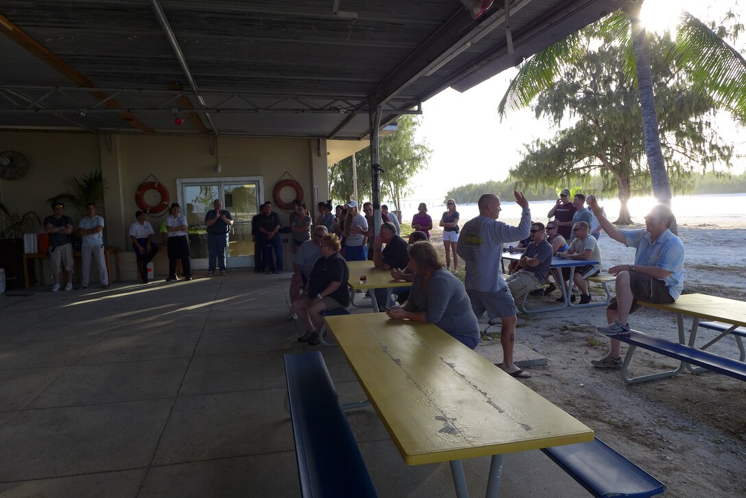 Wake Island, US Territory-- Capt Jason Hardman high fives audience members in preparation for Small Kine performing. (U.S. Air Force photo by TSgt Michael Smith) (released)