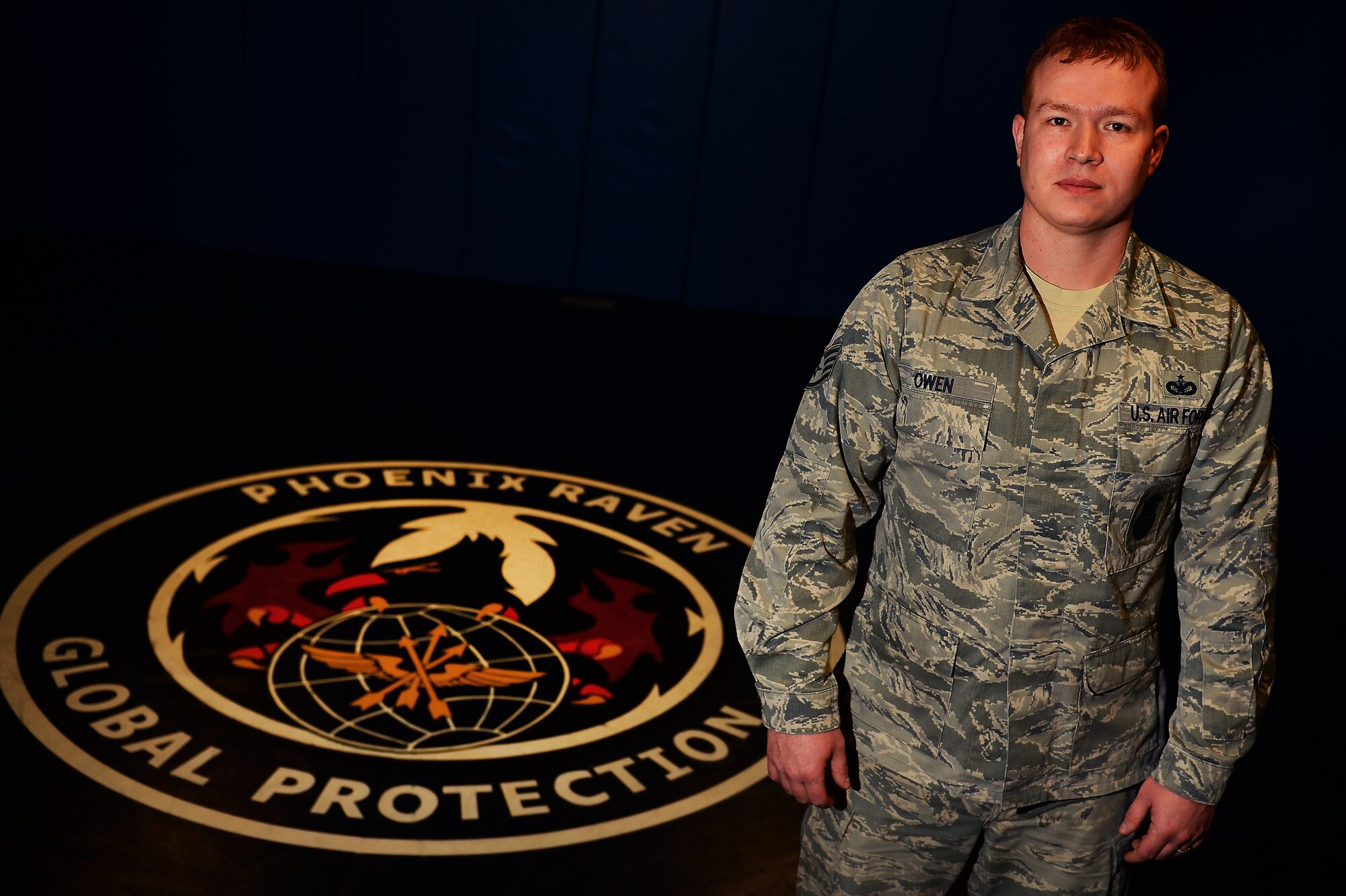 Staff Sgt. Wade Owen, 627th Security Forces Squadron deputy Raven program manager, stands in the Raven training room, Feb. 18, 2015, at Joint Base Lewis-McChord, Wash. Owen saved the life of Joe Akin, a retired Army veteran, by kicking down the door to Akin’s residence after he had succumbed to a nearly lethal dose of carbon monoxide. (U.S. Air Force photo/Staff Sgt. Tim Chacon)