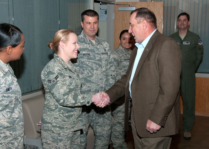 VANCE AIR FORCE BASE, Okla. -- (From left) Airmen 1st Class Faith Odom and Nancy Osborne Senior Airman Zachary Paskovitch show their Chief Master Sergeant of the Air Force coins at the 71st Flying Training Wing headquarters Feb. 11. Retired Chief Master Sgt. of the Air Force Frederick Finch, the Air Force's 13th senior enlisted leader, visited and held calls with all ranks later that evening. (U.S. Air Force photo / Terry Wasson) 
