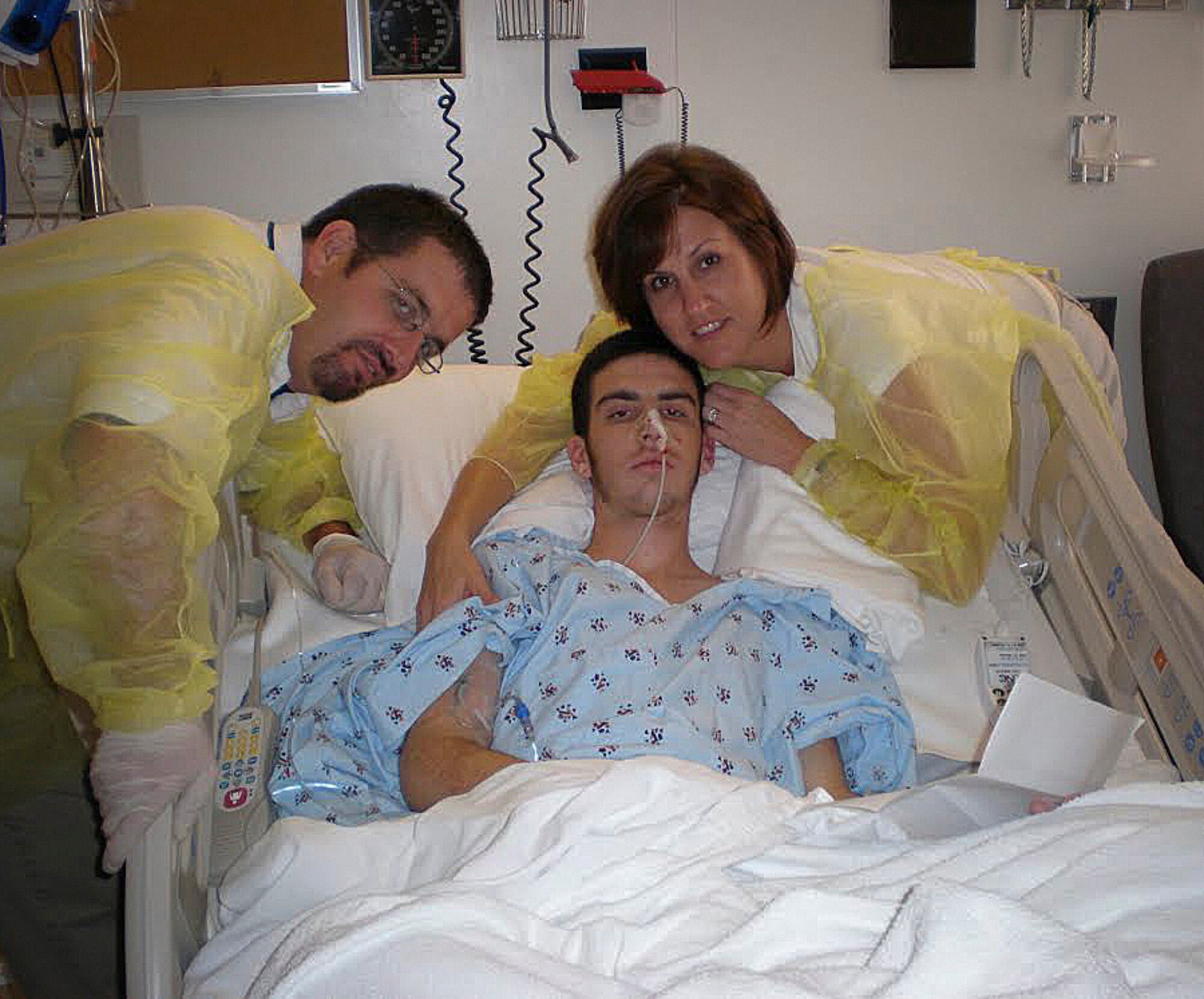 Staff Sgt. Ryan Smith, 6th Operations Support Squadron Aircrew Flight Equipment craftsman, lies in his hospital bed after waking up from a  coma. Smith had an adverse reaction to a pre-deployment Smallpox vaccination. According to the College of Physicians of Philadelphia, for every million people vaccinated for Smallpox, roughly 33 could have a life-threatening reaction to the vaccine. (Courtesy photo).
