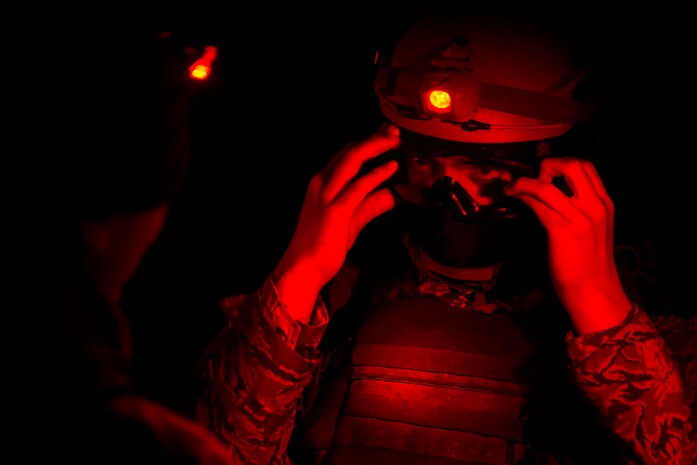 Staff Sgt. Steven Witt, a broadcaster assigned to the 1st Combat Camera Squadron, gears-up before a mission Feb. 10, 2015, at North Auxiliary Airfield, S.C., during an Ability to Survive and Operate exercise. The ATSO exercise is an annual event designed to test the ability of Air Force combat camera Airmen to survive, operate and provide imagery in an austere environment. Combat camera Airmen document a full range of military operations in support of senior leaders and combatant commanders. (U.S. Air Force photo/Senior Airman Jared Trimarchi)