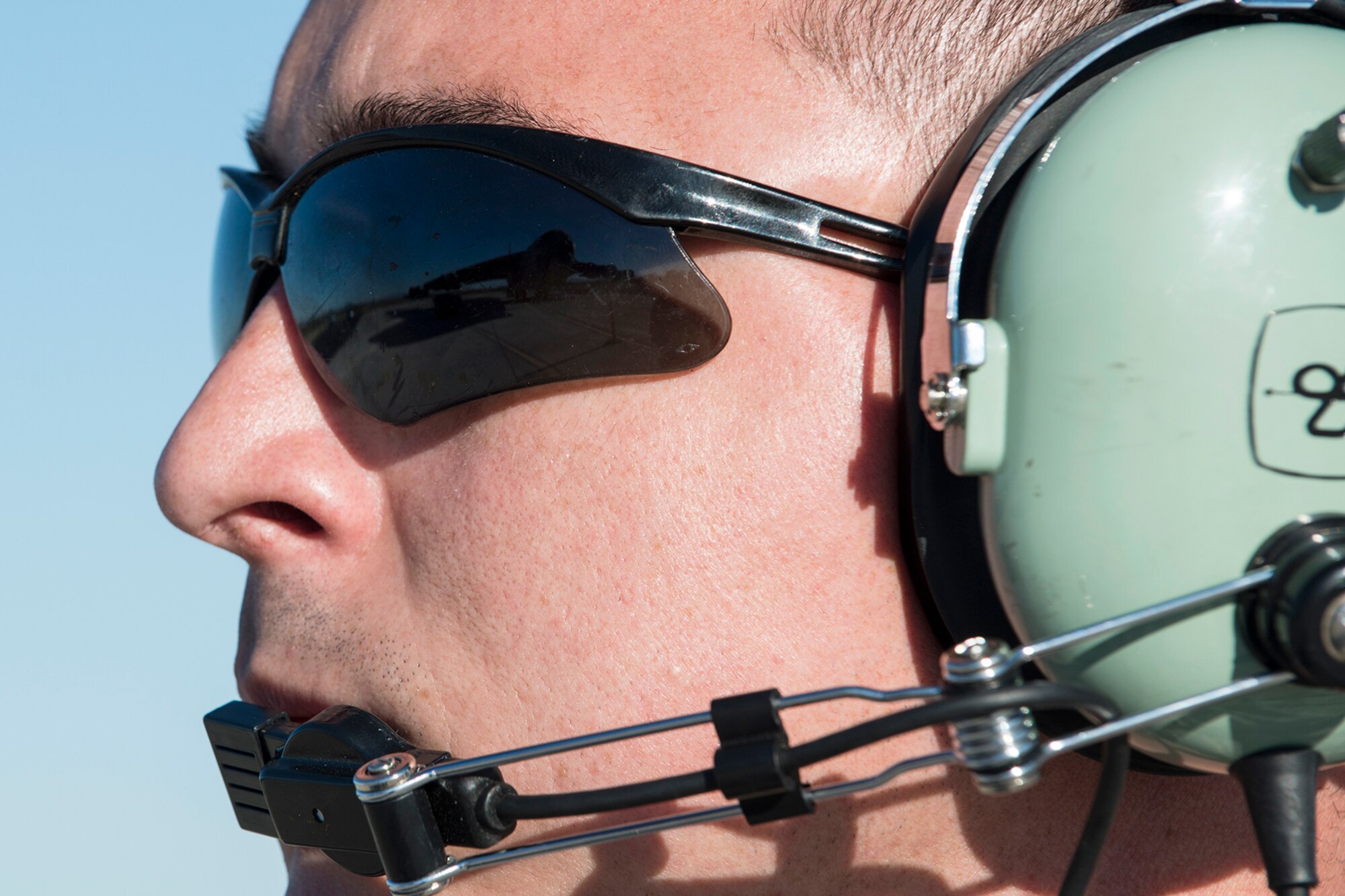 U.S. Air Force Staff Sgt. Matthew Cocran, 2nd Aircraft Maintenance Squadron crew chief, communicates with the aircrew aboard a B-52H Stratofortress before a taxi test on Feb. 12, 2015, Davis-Monthan Air Force Base, Ariz. The aircraft, known as the "Ghost Rider,” will undergo the taxi test to ensure the aircraft can be safely controlled down the runway before its flight to Barksdale Air Force Base, La, on Feb. 13. (U.S. Air Force photo by Master Sgt. Greg Steele/Released)
