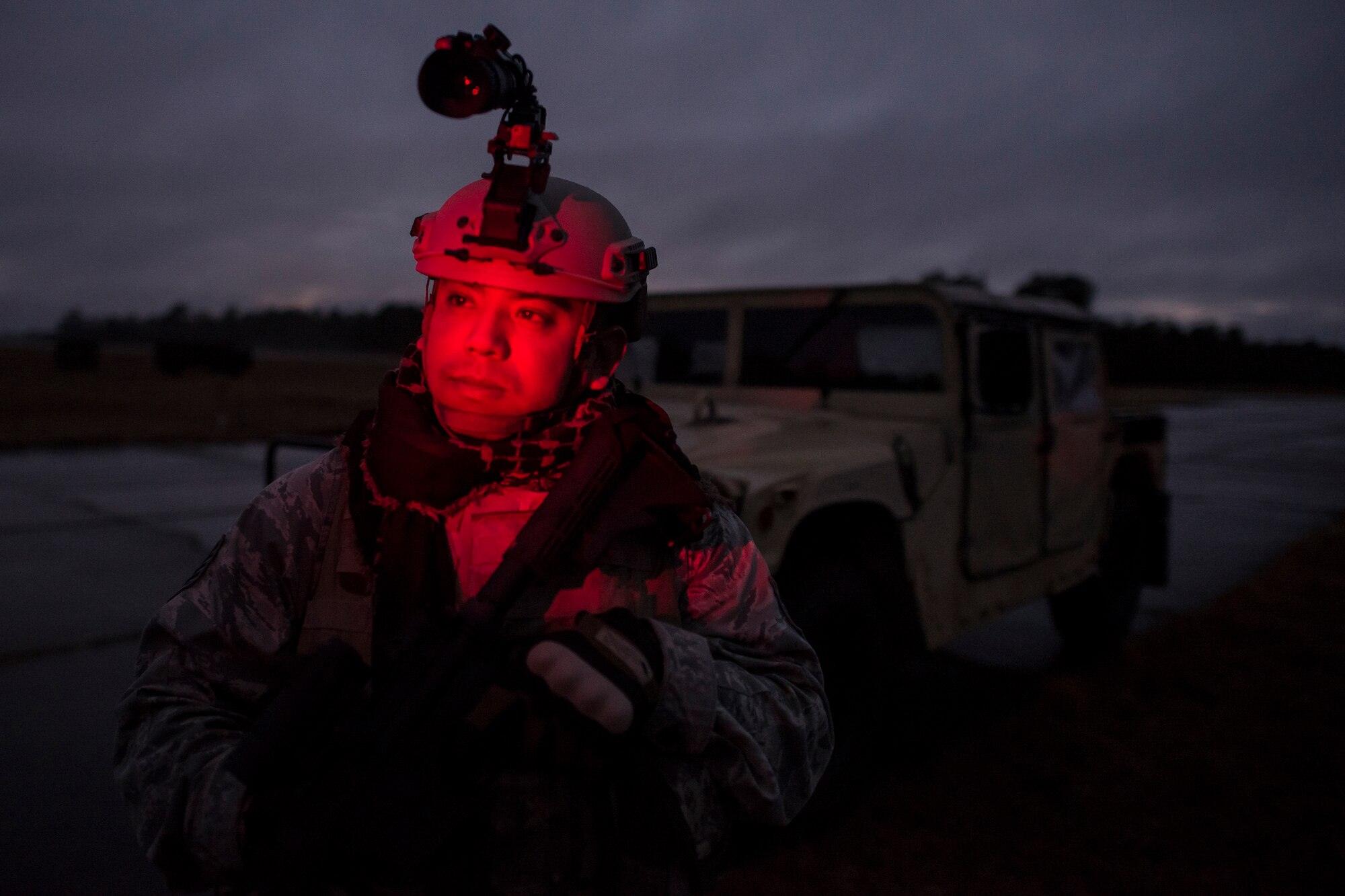 Technical Sgt. Joshua Garcia, a photojournalist assigned to the 1st Combat Camera Squadron, arrives at the simulated deployed location Feb. 9, 2015, at North Auxiliary Airfield, S.C., during an Ability to Survive and Operate exercise. The ATSO exercise is an annual event designed to test the ability of Air Force combat camera Airmen to survive, operate and provide imagery in an austere environment. Combat camera Airmen document a full range of military operations in support of senior leaders and combatant commanders. (U.S. Air Force photo/Senior Airman Jared Trimarchi)