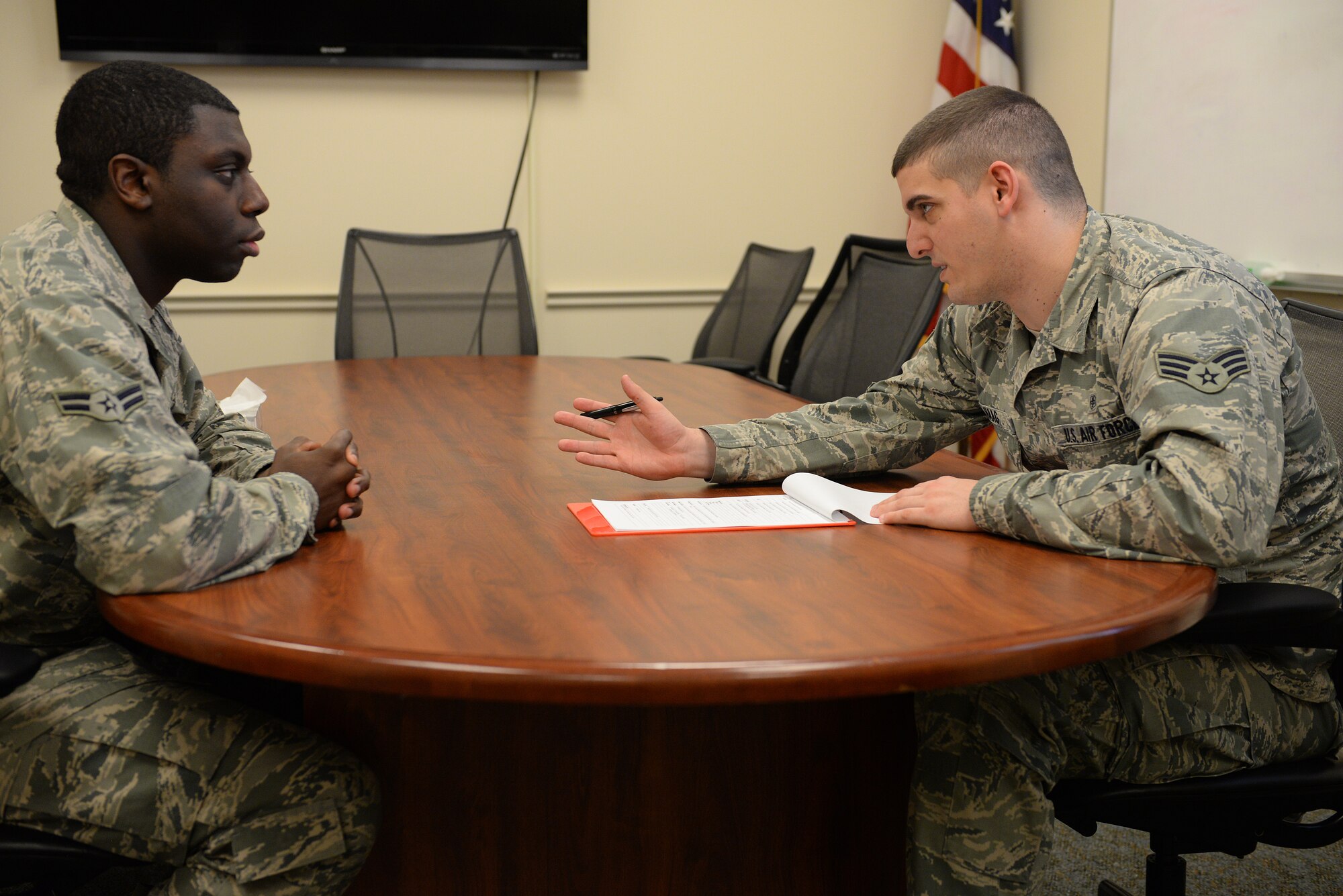 Airman 1st Class Brandon Haag, 375th Medical Group mental health technician, goes through new patient paperwork, Feb. 9, 2015. A typical protocol when a new patient comes in is getting to know the background history of the patient to help them and the provider they will see know what will help in a crisis or difficulty. (U.S. Air Force photo by Airman 1st Class Erica Crossen)