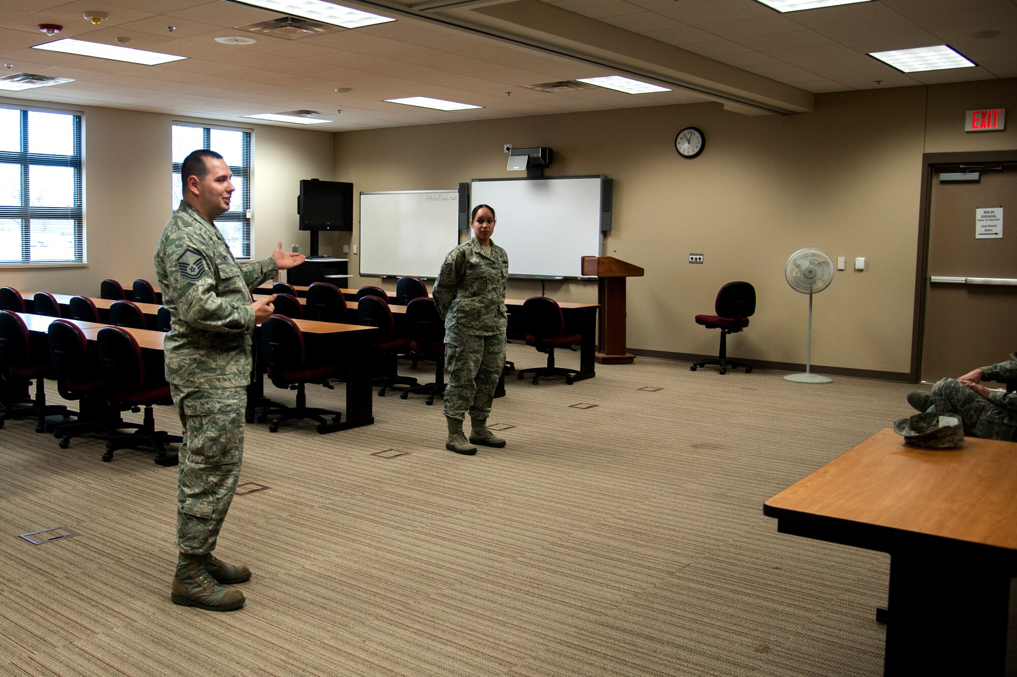 GOODFELLOW AIR FORCE BASE, Texas – Master Sgt. Michael A. Richter, 17th Training Support Squadron Faculty Development flight superintendent, introduces Staff Sgt. Christina M. Cordova, 17th Civil Engineer Squadron housing office manager, for Walk in My Boots at the Consolidated Learning Center Feb. 17, 2015. Walk in My Boots is a monthly event where Airman share their personal stories to inspire and mentor other Airman. (U.S. Air Force photo/ Senior Airman Scott Jackson)