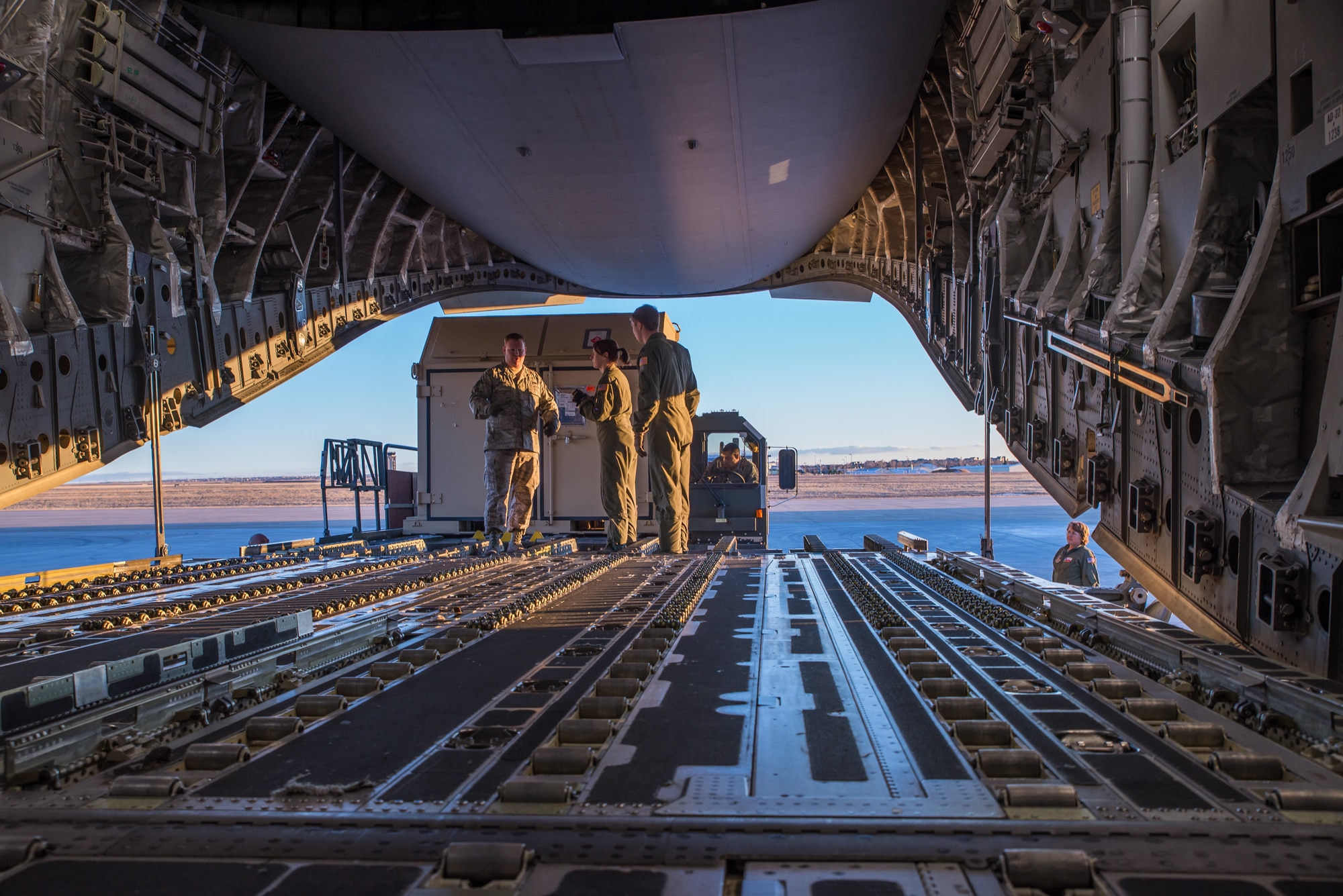 Airmen assigned to the 153rd Airlift Wing, Wyoming Air National Guard, Cheyenne, Wyoming, load cargo Feb. 11, 2015, at Buckley Air Force Base in Aurora, Colorado in support of the 140th Wing, Colorado Air National Guard deployment to South Korea.
The WY ANG air transportation specialists along with an airman from the 90th Missile Wing, F.E. Warren Air Force Base, Cheyenne, collaborated with the 433rd Airlift Control Flight and 733rd Student Training Squadron, Joint Base Lackland, to upload over 311,000 pounds of cargo. (U.S. Air National Guard photo by Master Sgt. Charles Delano/released)
