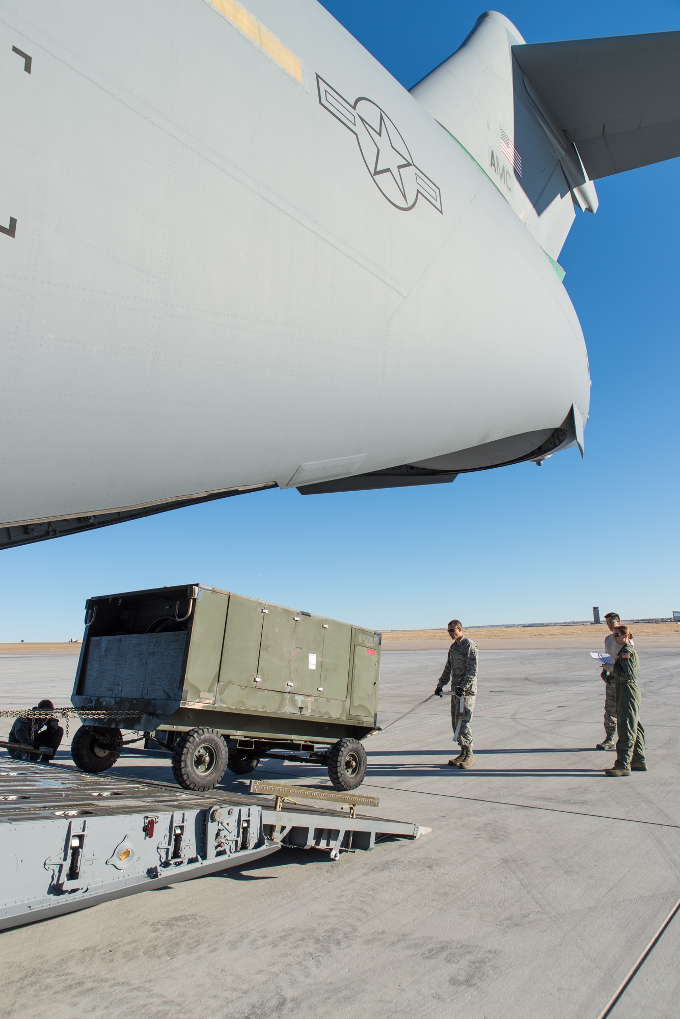 Airmen assigned to the 153rd Airlift Wing, Wyoming Air National Guard, Cheyenne, Wyoming, load cargo Feb. 11, 2015, at Buckley Air Force Base in Aurora, Colorado in support of the 140th Wing, Colorado Air National Guard deployment to South Korea.
The WY ANG air transportation specialists along with an airman from the 90th Missile Wing, F.E. Warren Air Force Base, Cheyenne, collaborated with the 433rd Airlift Control Flight and 733rd Student Training Squadron, Joint Base Lackland, to upload over 311,000 pounds of cargo. (U.S. Air National Guard photo by Master Sgt. Charles Delano/released)
