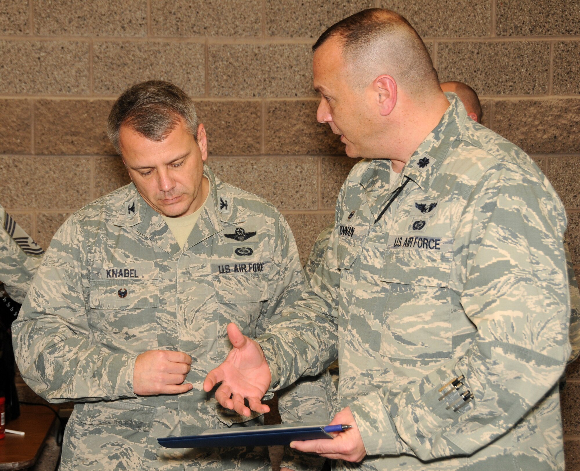 Lt. Col. Troy Drennan, 169th Intelligence Squadron Commander, brainstorms with 
Col. John Knabel, Chief, Intelligence, Surveillance, Reconnaissance Forces 
Division, Air National Guard, National Guard Bureau, during a break between 
sessions at the Weapons Systems Council Conference held at Roland R. Wright 
Air National Guard Base February 2-3. More than two dozen members of the 
intelligence community gathered from across the nation to discuss existing and 
emerging issues. (Air National Guard photo by Capt. Jennifer Eaton/RELEASED)