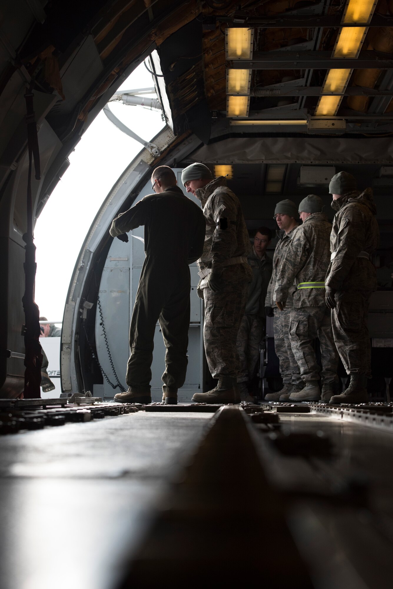 Loadmasters review the manifest for their aircraft during the Sharpshooter 1501 Max Generation exercise held at Mountain Home Air Force Base, Idaho, Jan. 23, 2015. The entire base participated in the exercise to assess areas that need improvement to uphold the Air Force mission of readiness. (U.S. Air Force photo by Airman Jeremy L. Mosier/RELEASED)