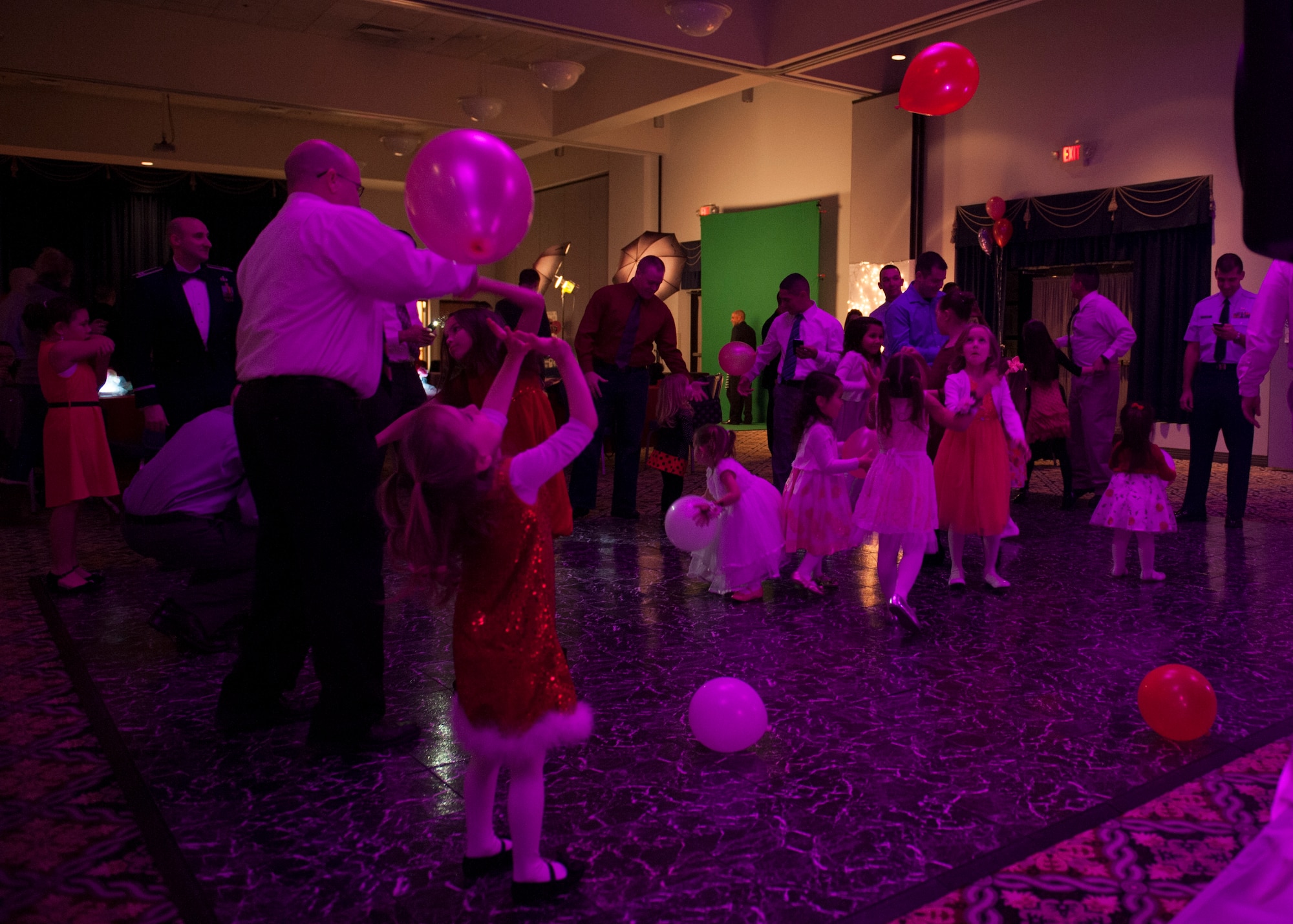 Fathers and their daughters dance during a Daddy Daughter Dance Feb. 13, 2015, at the Landings Club on Dover Air Force Base, Del. More than 128 fathers and daughters attended this event. (U.S. Air Force photo/Airman 1st Class Zachary Cacicia)