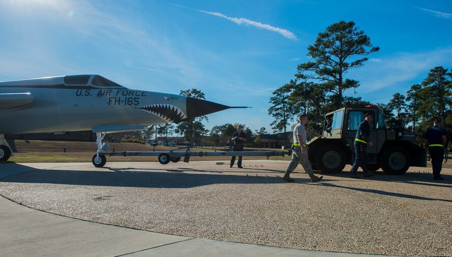 Members of the 23d Equipment Maintenance Squadron return the F-105 Thunderchief “Thud” back to the President George W. Bush Air Park Feb. 13, 2015, at Moody Air Force Base, Ga. This particular F-105 shot down an MiG-17 and flew missions with the 355th Tactical Fighter Wing in Thailand. (U.S. Air Force photo by Airman 1st Class Ceaira Tinsley/Released)