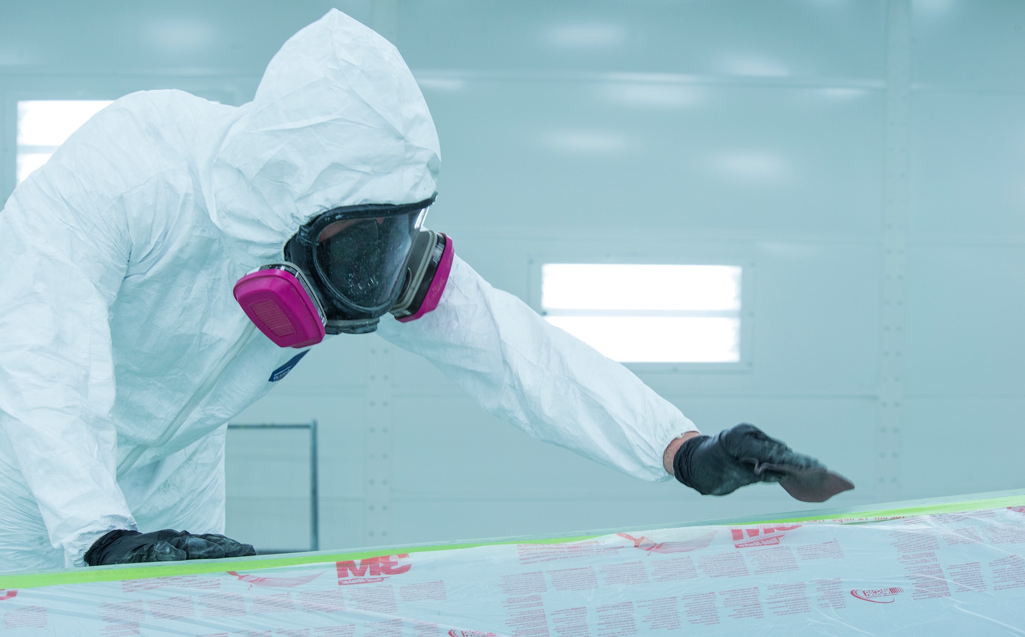 U.S. Air Force Senior Airman Joseph Brown, 23d Equipment Maintenance Squadron aircraft structural maintenance journeyman, sands F-105 Thunderchief “Thud” Feb. 11, 2015, at Moody Air Force Base, Ga. Brown sanded the aircraft to make it easier to paint before applying primer and a top coat. (U.S. Air Force photo by Airman 1st Class Ceaira Tinsley/Released)
