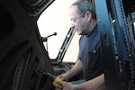 Ernie Boulet, 502nd Trainer Development Squadron sheet metal shop supervisor, drills the  C-17 fuselage Feb. 11 as he prepares the aircraft for shipment. (U.S. Air Force photo by Joel Martinez)  
