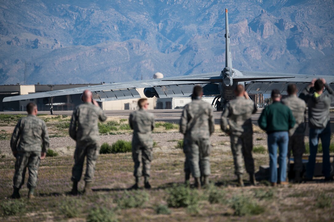 U.S. Air Force Airmen watch a B-52H Stratofortress taxi for takeoff after being taken out of long term storage at the 309th Aerospace Maintenance and Regeneration Group, Feb. 13, 2015, Davis-Monthan Air Force Base, Arizona. The aircraft was decommissioned in 2008 and has spent the last seven years sitting in the “Boneyard,” but was selected to be returned to active status and will eventually rejoin the B-52 fleet. (U.S. Air Force photo by Master Sgt. Greg Steele/Released)