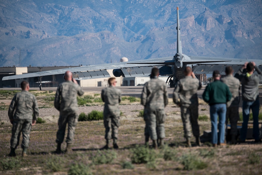 U.S. Air Force Airmen watch a B-52H Stratofortress taxi for takeoff after being taken out of long term storage at the 309th Aerospace Maintenance and Regeneration Group, Feb. 13, 2015, Davis-Monthan Air Force Base, Arizona. The aircraft was decommissioned in 2008 and has spent the last seven years sitting in the “Boneyard,” but was selected to be returned to active status and will eventually rejoin the B-52 fleet. (U.S. Air Force photo by Master Sgt. Greg Steele/Released)