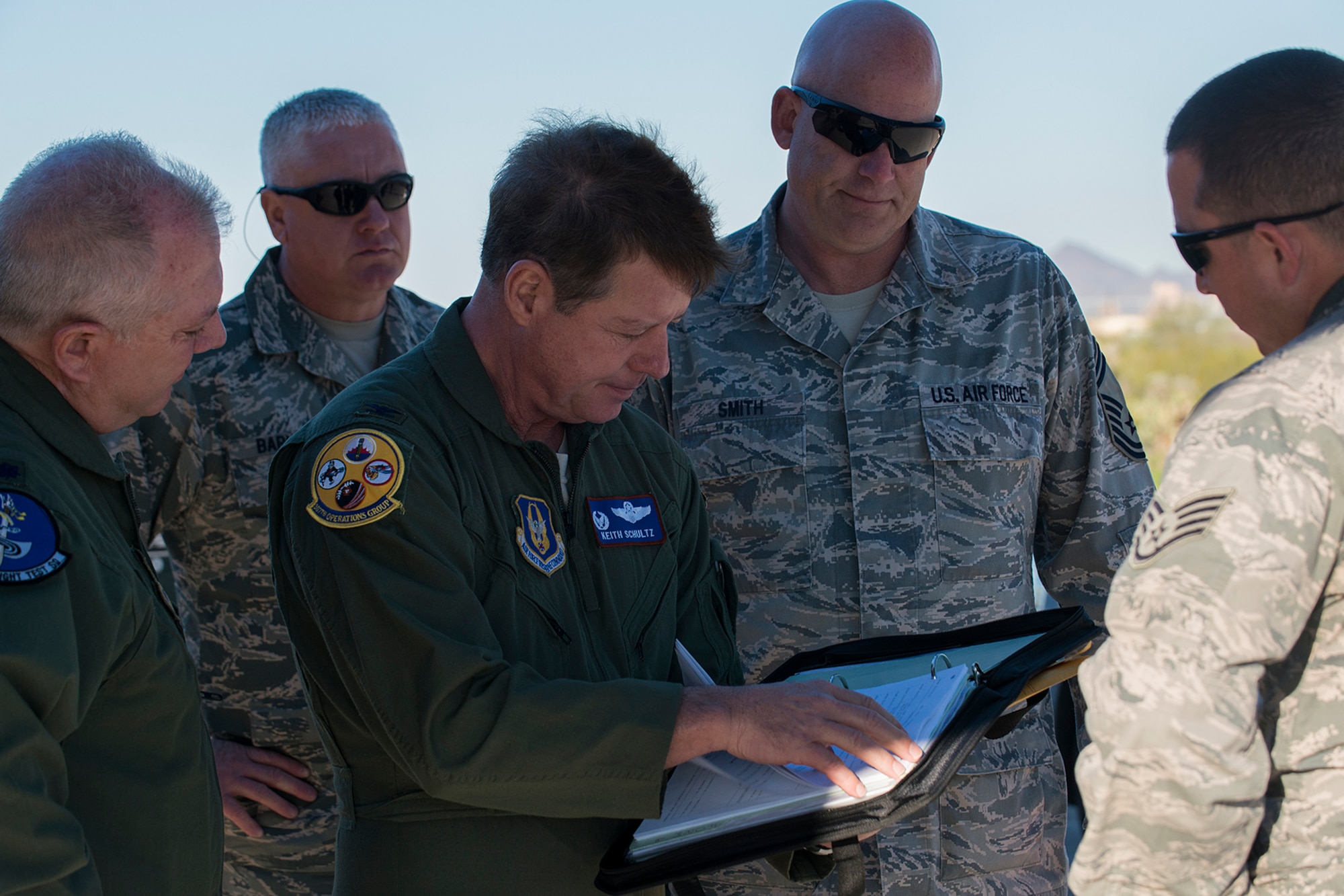 U.S. Air Force Col. Keith Schultz, 307th Operations Group commander, looks over the aircraft forms of a B-52H Stratofortress before a flight on Feb. 13, 2015, Davis-Monthan Air Force Base, Ariz. Schultz, who has over 6,500 flying hours in the B-52, will pilot the aircraft on its flight from the "Boneyard" since sitting in storage for seven years after being decommissioned in 2008. (U.S. Air Force photo by Master Sgt. Greg Steele/Released)