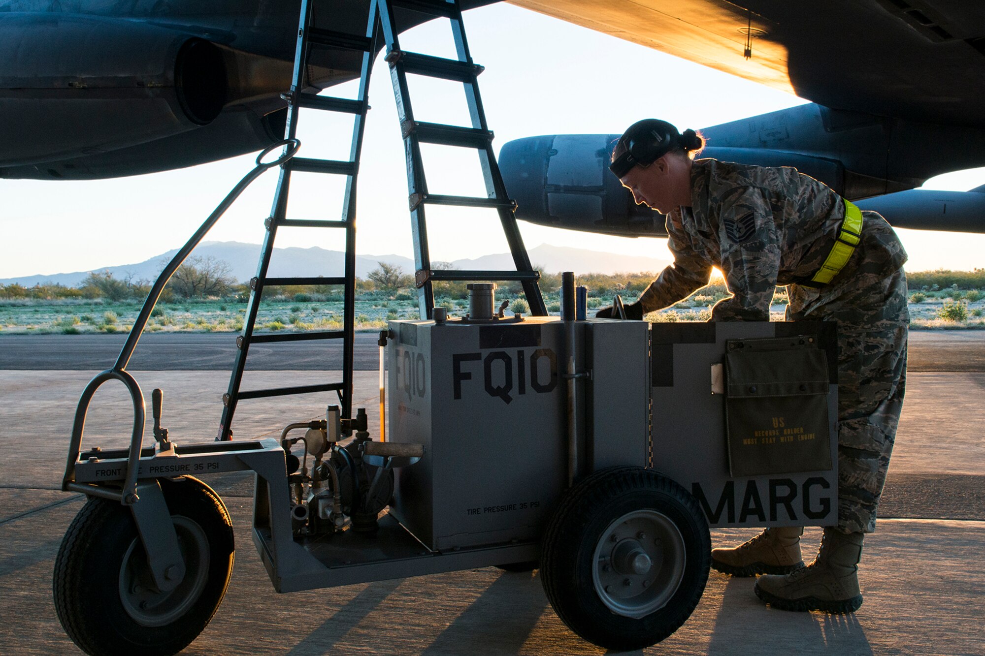 U.S. Air Force Tech. Sgt. Suann Becton, a 565th Aircraft Maintenance Squadron crew chief, services a B-52H Stratofortress before its flight on Feb. 13, 2015, Davis-Monthan Air Force Base, Ariz. Becton is a member of the maintenance team that regenerated aircraft 61-007 after spending the last seven years in 1000-type storage at the 309th Aerospace Maintenance and Regeneration Group's "Boneyard." (U.S. Air Force photo by Master Sgt. Greg Steele/Released)