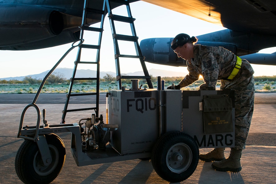 U.S. Air Force Tech. Sgt. Suann Becton, a 565th Aircraft Maintenance Squadron crew chief, services a B-52H Stratofortress before its flight on Feb. 13, 2015, Davis-Monthan Air Force Base, Ariz. Becton is a member of the maintenance team that regenerated aircraft 61-007 after spending the last seven years in 1000-type storage at the 309th Aerospace Maintenance and Regeneration Group's "Boneyard." (U.S. Air Force photo by Master Sgt. Greg Steele/Released)