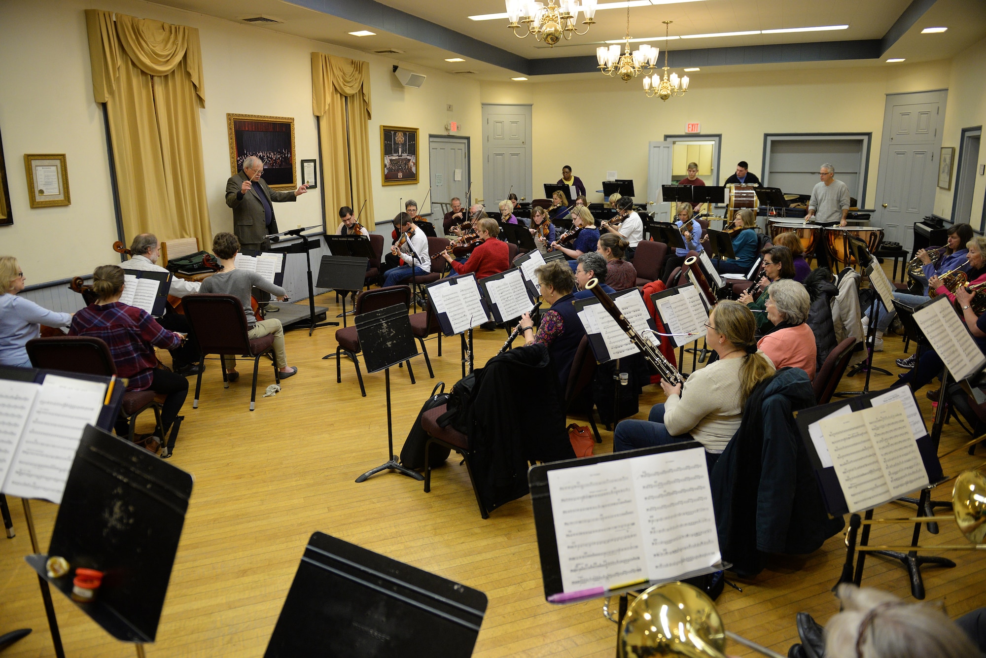 The historic Belleville Philharmonic Orchestra creates music during an evening rehearsal, Belleville, Ill., Jan. 29, 2015. The orchestra was rehearsing music from the film ‘Frozen’ for their upcoming concert. The orchestra is the second oldest in the United States, playing since 1867. (U.S. Air Force photo by Airman 1st Class Erica Crossen)