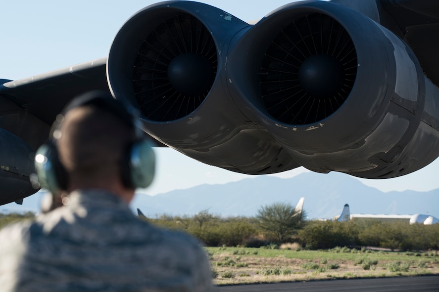 A crew chief awaits the engine start of a B-52H Stratofortress during a taxi test on Feb. 12, 2015, Davis-Monthan Air Force Base, Ariz. The aircraft, known as the "Ghost Rider,” will undergo the taxi test to ensure the aircraft can be safely controlled down the runway before its flight to Barksdale Air Force Base, La, on Feb. 13. (U.S. Air Force photo by Master Sgt. Greg Steele/Released)