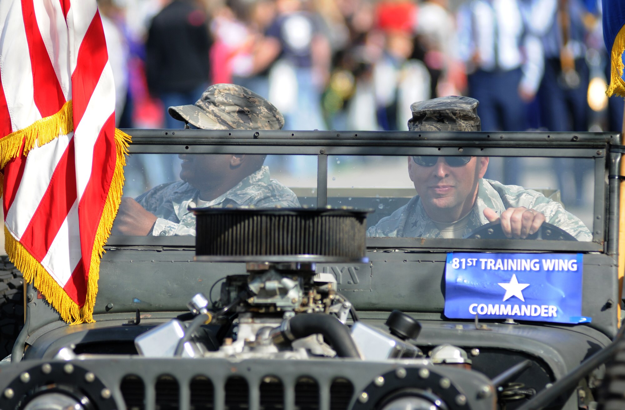 Chief Master Sgt. Harry Hutchinson, 81st Training Wing command chief, and Brig. Gen. Patrick Higby, 81st TRW commander, serve as Grand Marshalls during the Jeff Davis Elementary School Mardi Gras Parade in Biloxi, Miss., Feb. 13, 2015.  The Keesler Honor Guard and other base personnel also participated in the festivities.  (U.S. Air Force photo by Kemberly Groue)