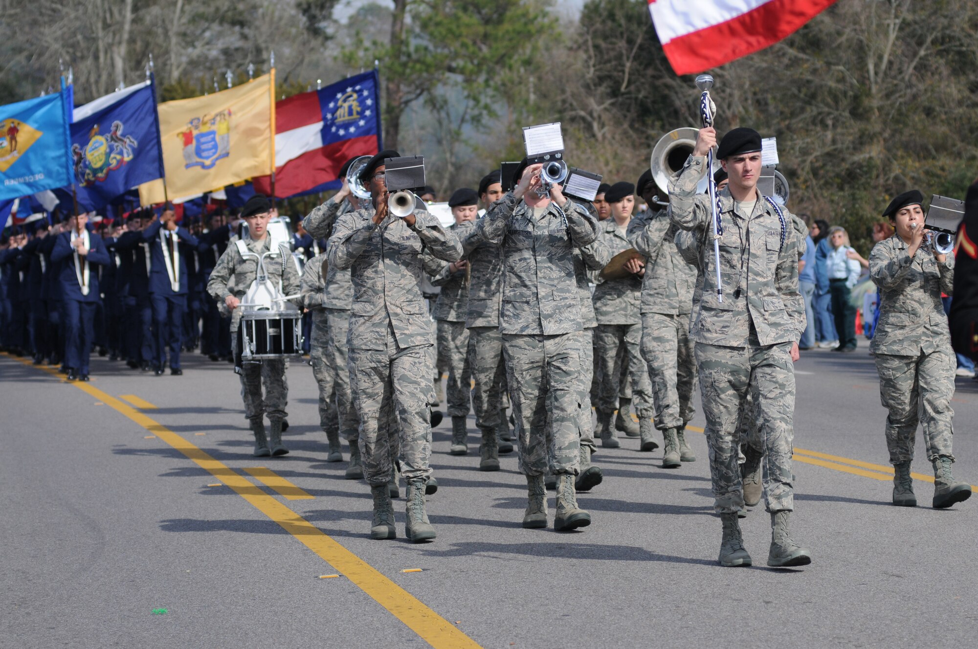 The 81st Training Group drum and bugle corps and Airmen carrying the 50 state flags lead the North Bay Area Mardi Gras Parade in D’Iberville, Miss., Feb. 16, 2015.  Leadership from the Keesler Air Force Base also participated in the festivities. (U.S. Air Force photo by Kemberly Groue)