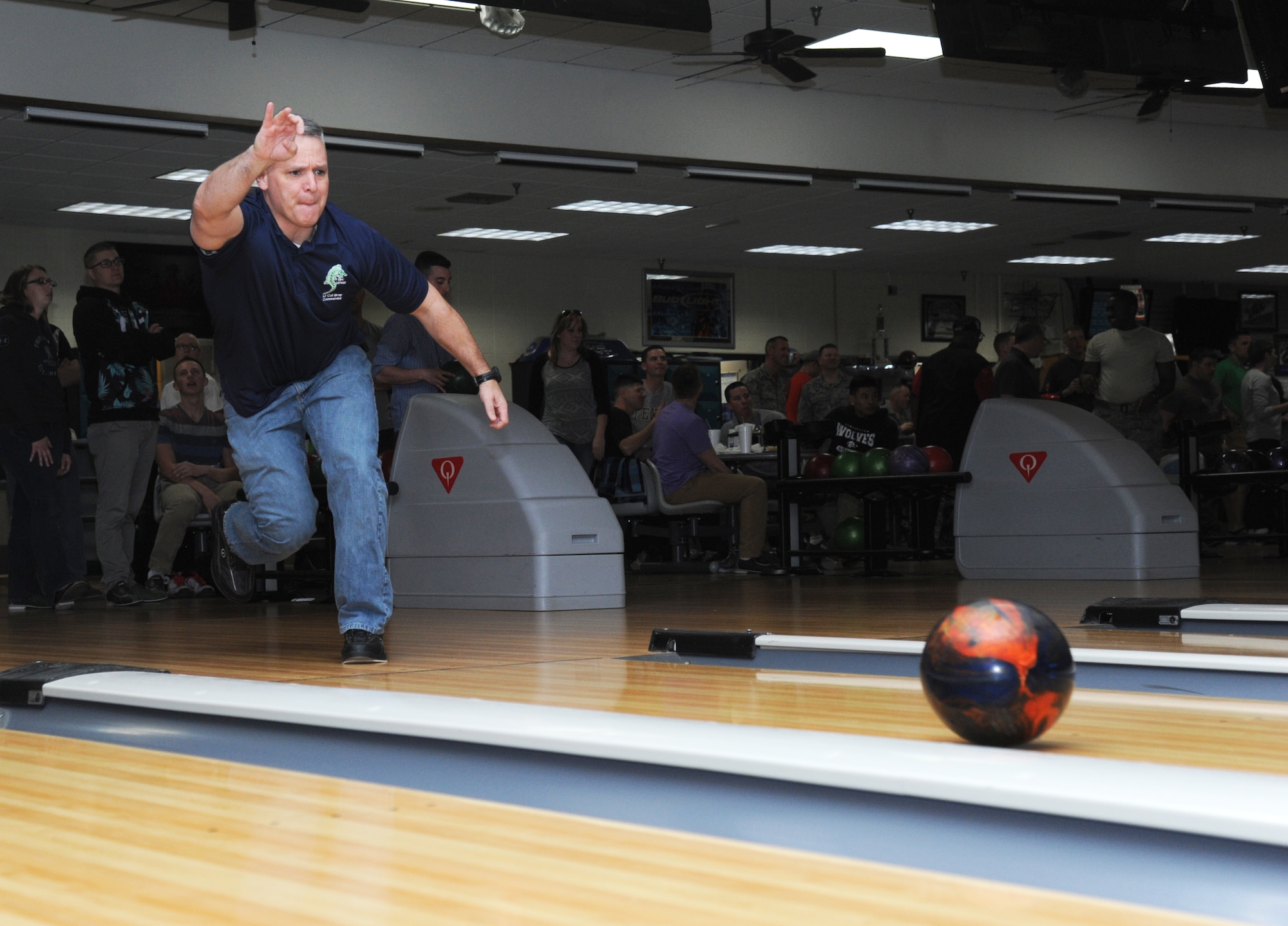Lt. Col. Kevin Bray, 334th Training Squadron commander, sends his ball down the lane during a bowling tournament Feb. 13, 2015, at Gaudé Bowling Lanes, Keesler Air Force Base, Miss.  The African-American Heritage Committee hosted the event to celebrate Black History Month.  Nineteen teams of five people participated in the tournament.  (U.S. Air Force photo by Kemberly Groue)