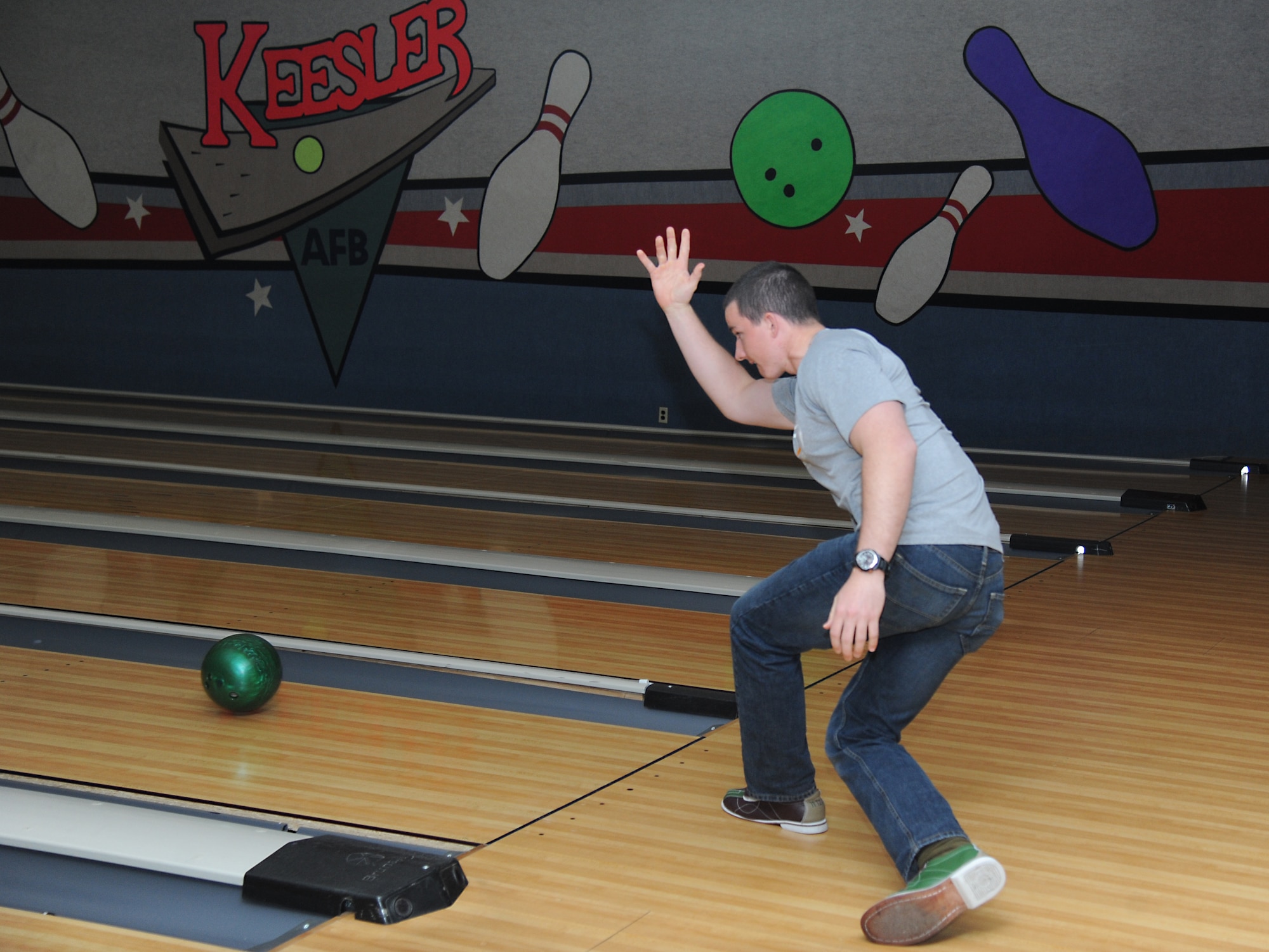 Airman Michael Ehlen, 335th Training Squadron student, sends his ball down the lane during a bowling tournament Feb. 13, 2015, at Gaudé Bowling Lanes, Keesler Air Force Base, Miss.  The African-American Heritage Committee hosted the event to celebrate Black History Month.  Nineteen teams of five people participated in the tournament.  (U.S. Air Force photo by Kemberly Groue)