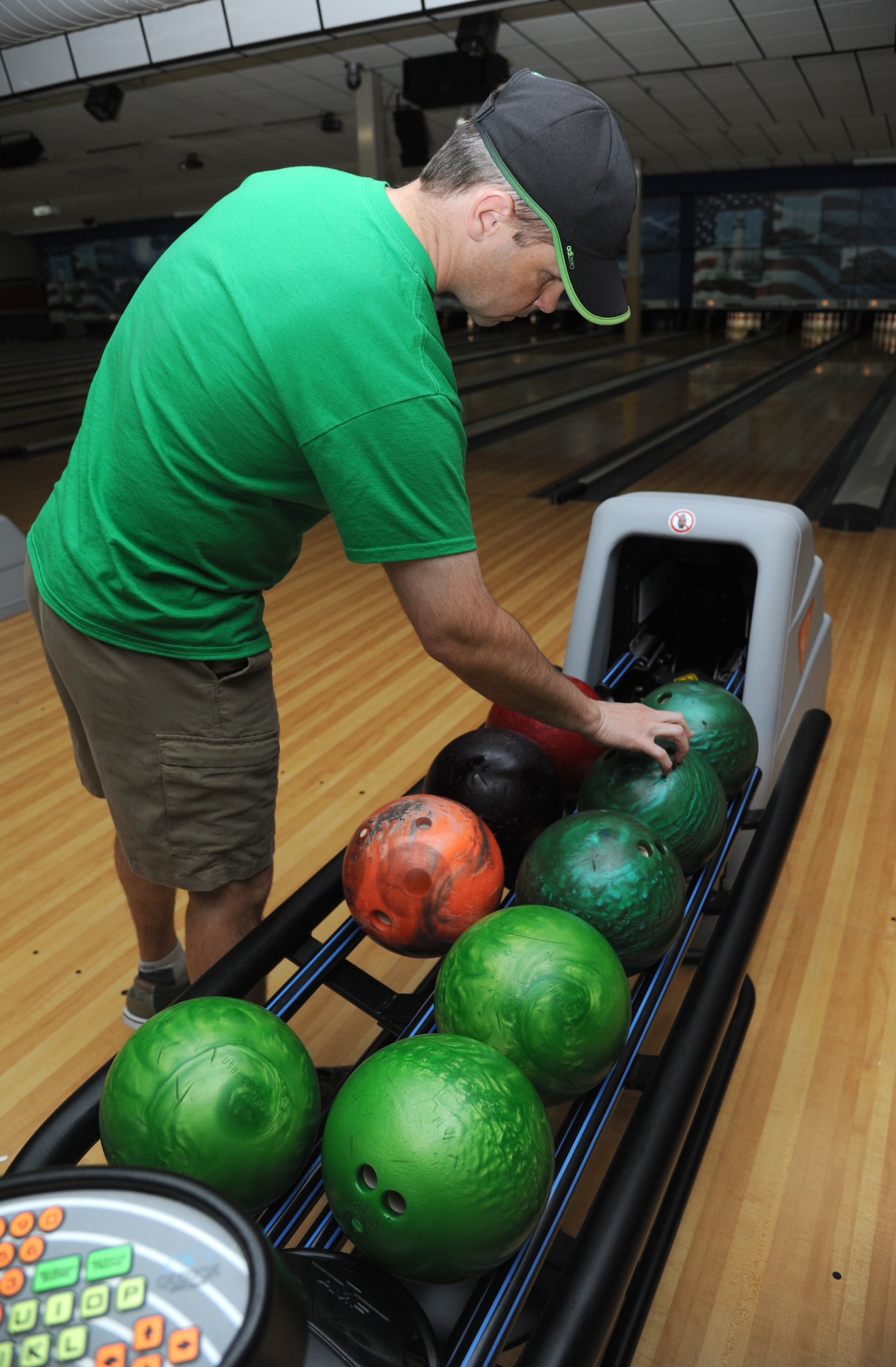 Maj. Jason Freels, 602nd Training Group (Provisional) chief of plans and analysis, selects his ball during a bowling tournament Feb. 13, 2015, at Gaudé Bowling Lanes, Keesler Air Force Base, Miss.  The African-American Heritage Committee hosted the event to celebrate Black History Month. Nineteen teams of five people participated in the tournament.  (U.S. Air Force photo by Kemberly Groue)