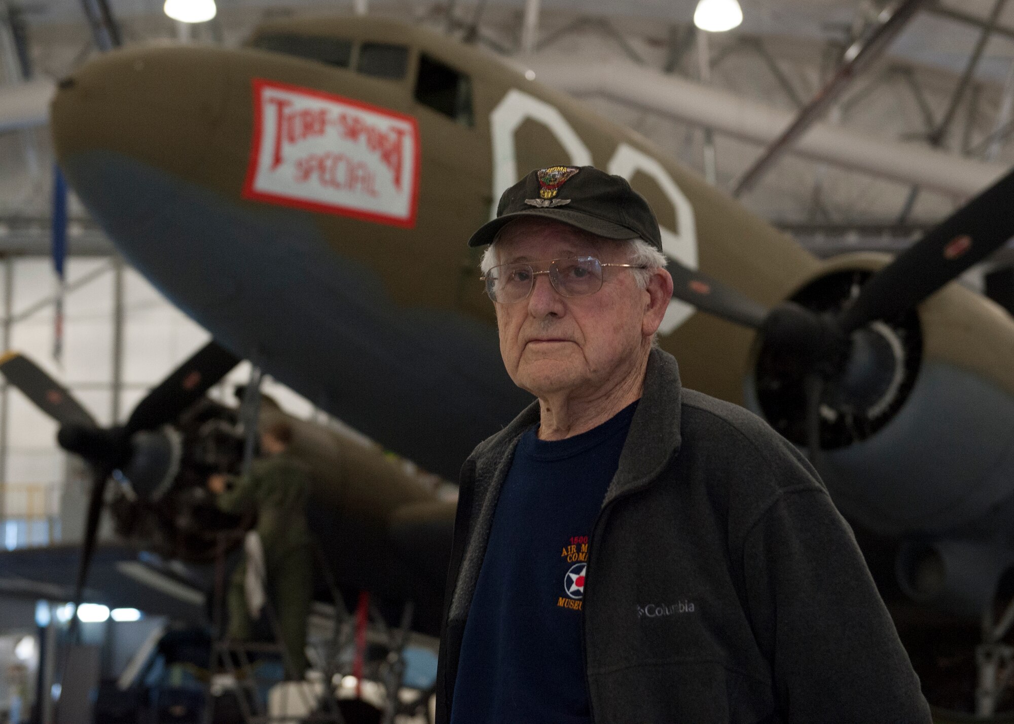 Don Clark poses in front of a C-47A Skytrain Jan. 28, 2015, at the Air Mobility Command Museum on Dover Air Force Base, Del. Clark piloted C-47s, much like this one, during World War II. (U.S. Air Force photo/Airman 1st Class Zachary Cacicia)