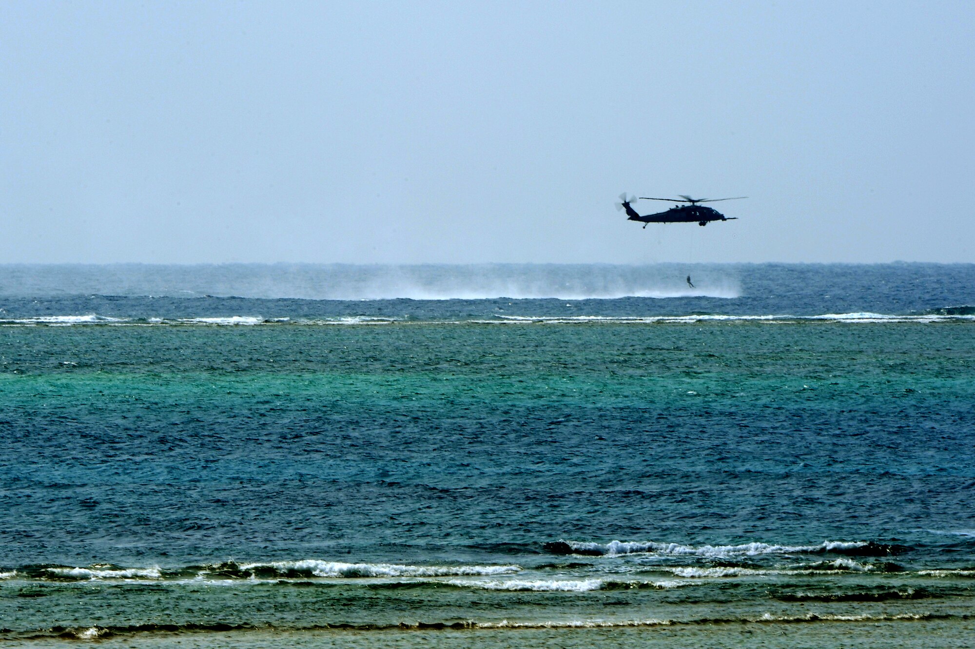 A 33rd Rescue Squadron HH60-G Pave Hawk helicopter performs a simulated rescue operation during a bilateral training exercise on Torii Station, Japan, Feb. 17, 2015. The exercise simulated an aircraft mishap and involved the participation of U.S. military and Japanese emergency response agencies. Their readiness and interoperability were tested as they worked together to respond to the simulated wreck and provide care to those with simulated injuries. (U.S. Air Force photo by Airman 1st Class Zade C. Vadnais)
