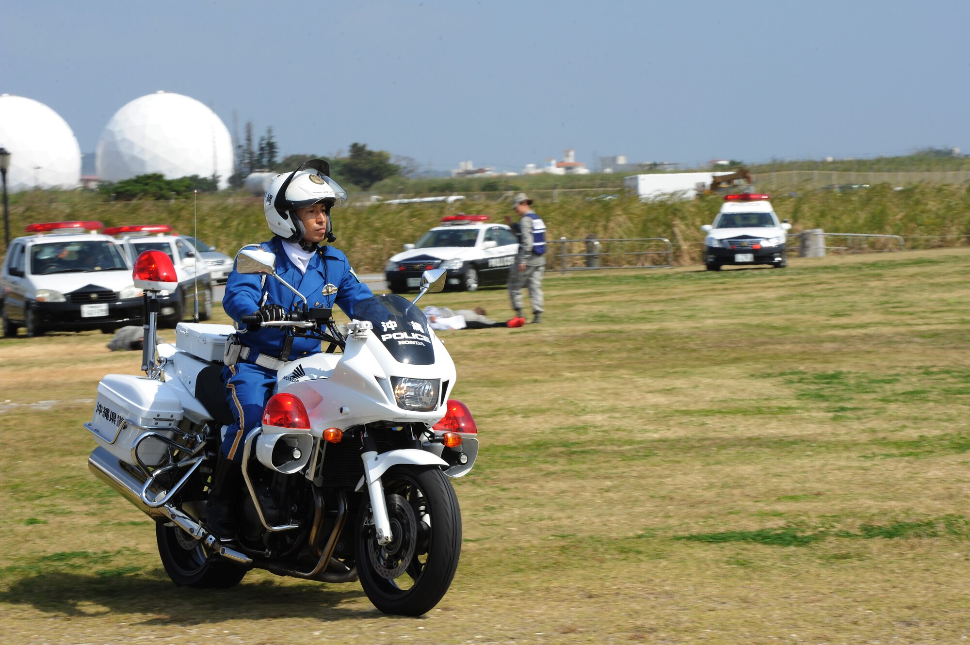 Personnel from the Okinawa Police Department are the first to respond to a simulated aircraft mishap during a bilateral training exercise on Torii Station, Japan, Feb. 17, 2015. The purpose of this annual exercise is to improve the interoperability and communication between Japanese and U.S. military emergency response agencies, increasing the readiness and effectiveness of participating agencies. (U.S. Air Force photo by Airman 1st Class Zade C. Vadnais)