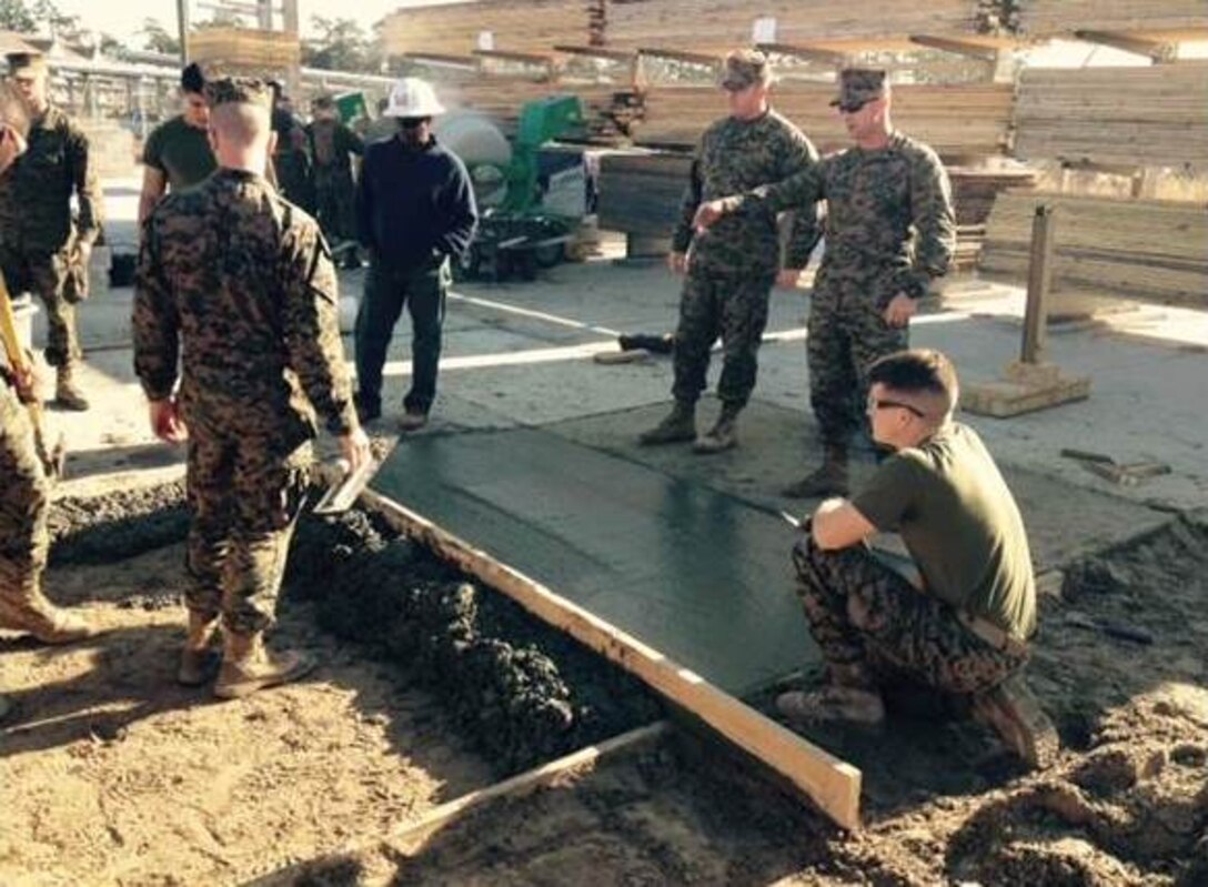 Marines of BCE10-15 construct a concrete pad.