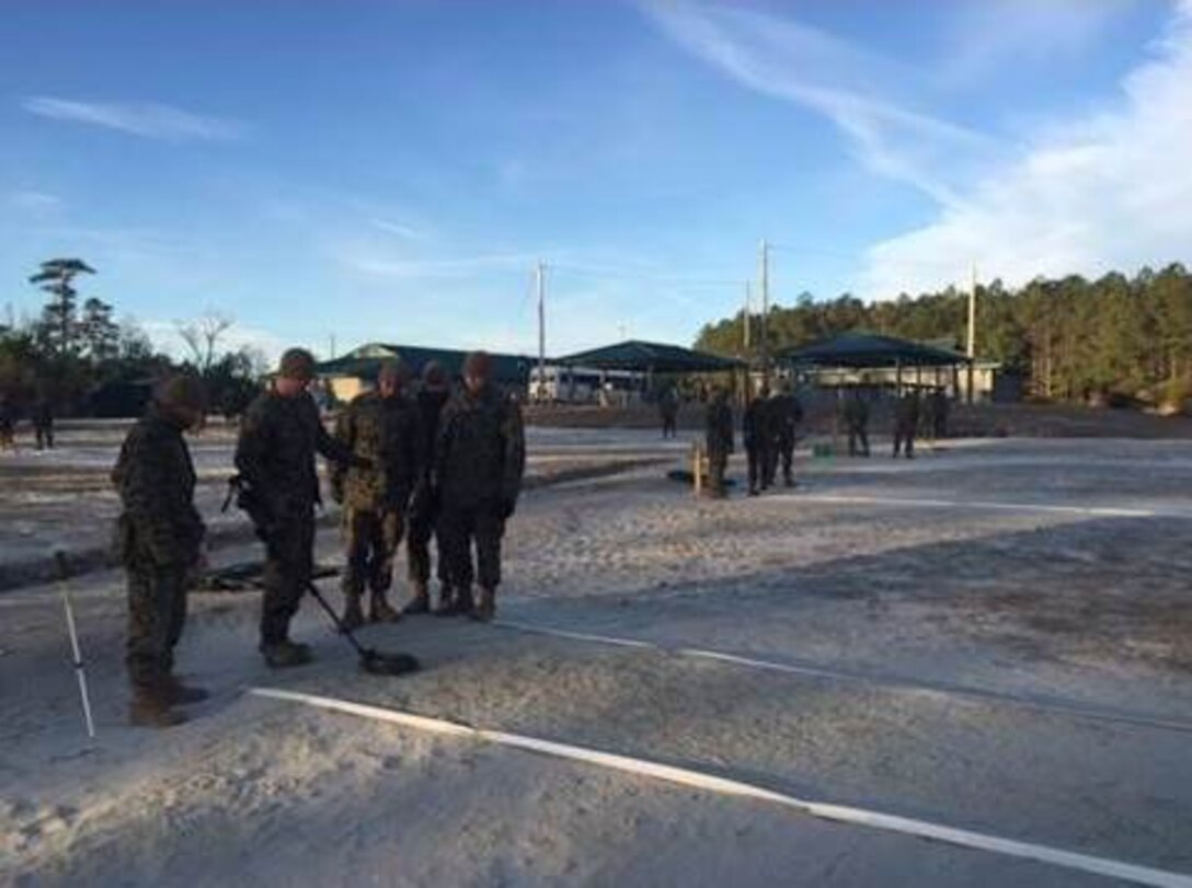 Marines of BCE 11-15 learn proper sweeping techniques.