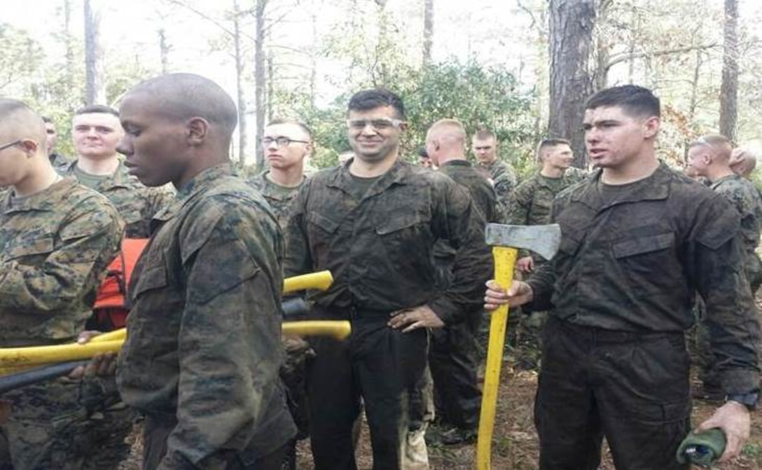 Marines of BCE 11-15 learn how to cut logs.