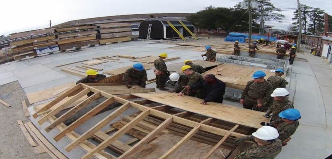 Marines of BCE 12-15 learn how to build a roof.