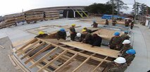 Marines of BCE 12-15 learn how to build a roof.